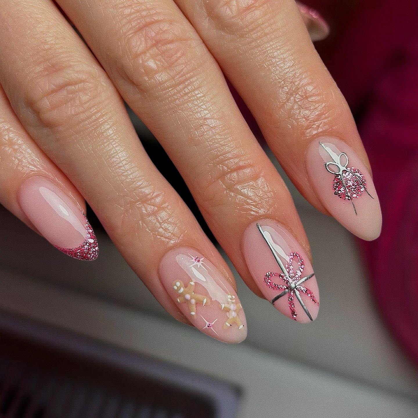Soft Pink Almond Nails with Delicate Bow and Gold Details