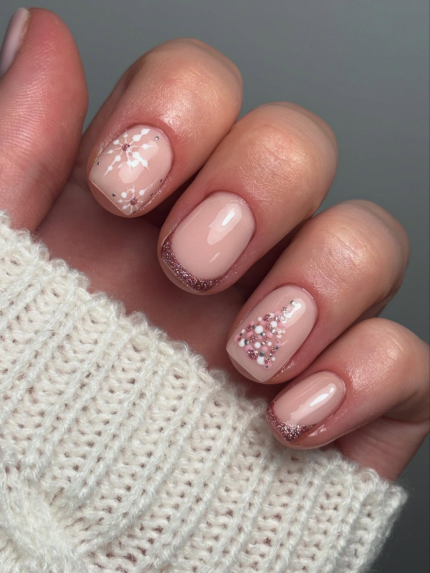 Short Pink Nails with White Snowflakes and Sparkle