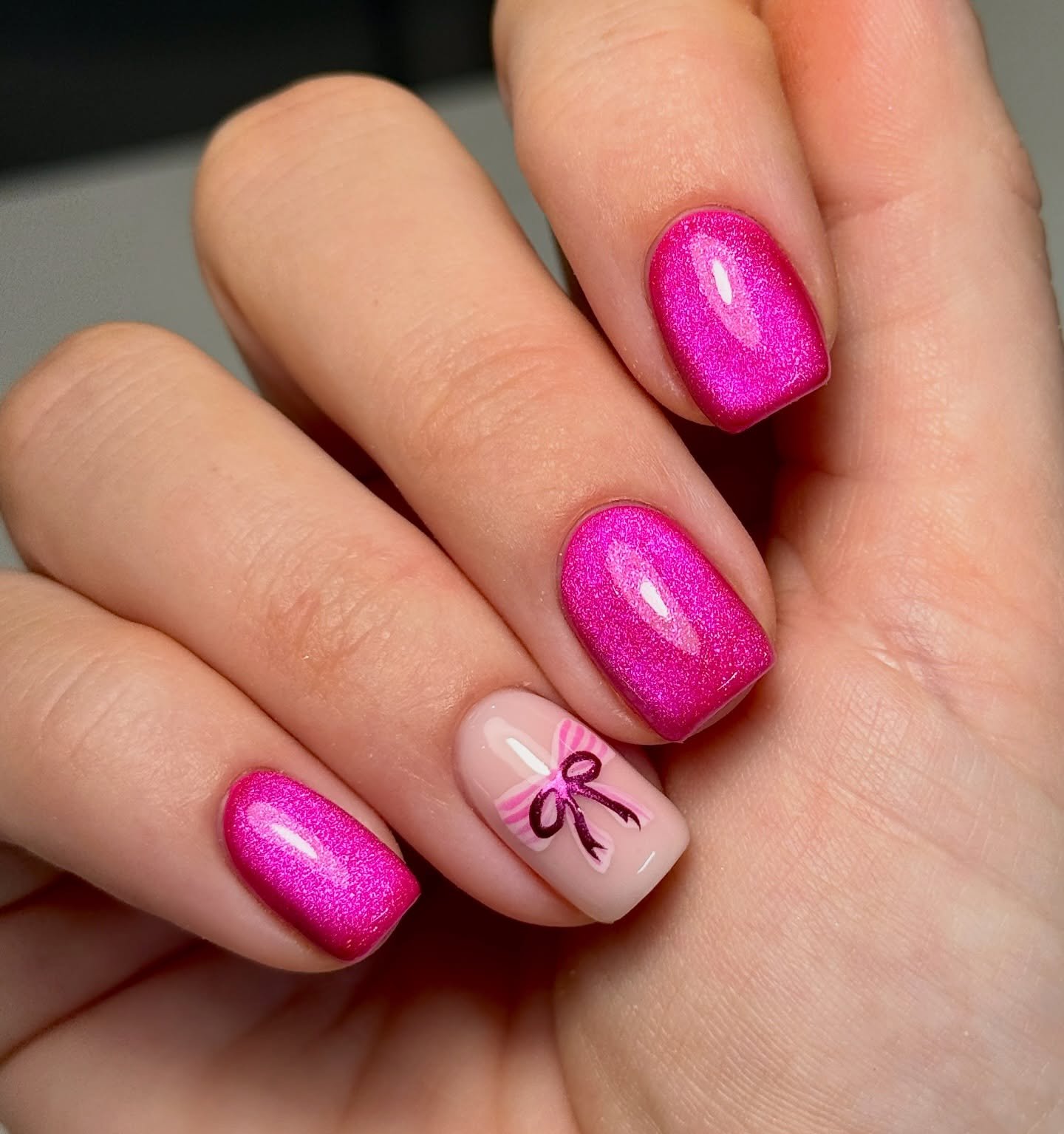 Hot Pink Short Square Nails with a Bow Accent
