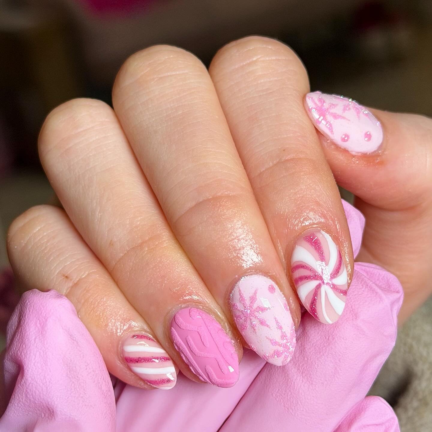 Pink Christmas Nails with Candy Stripes, Snowflakes and Bows