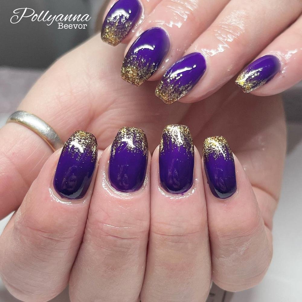 Short Purple Nails with Gold Glitter Tips