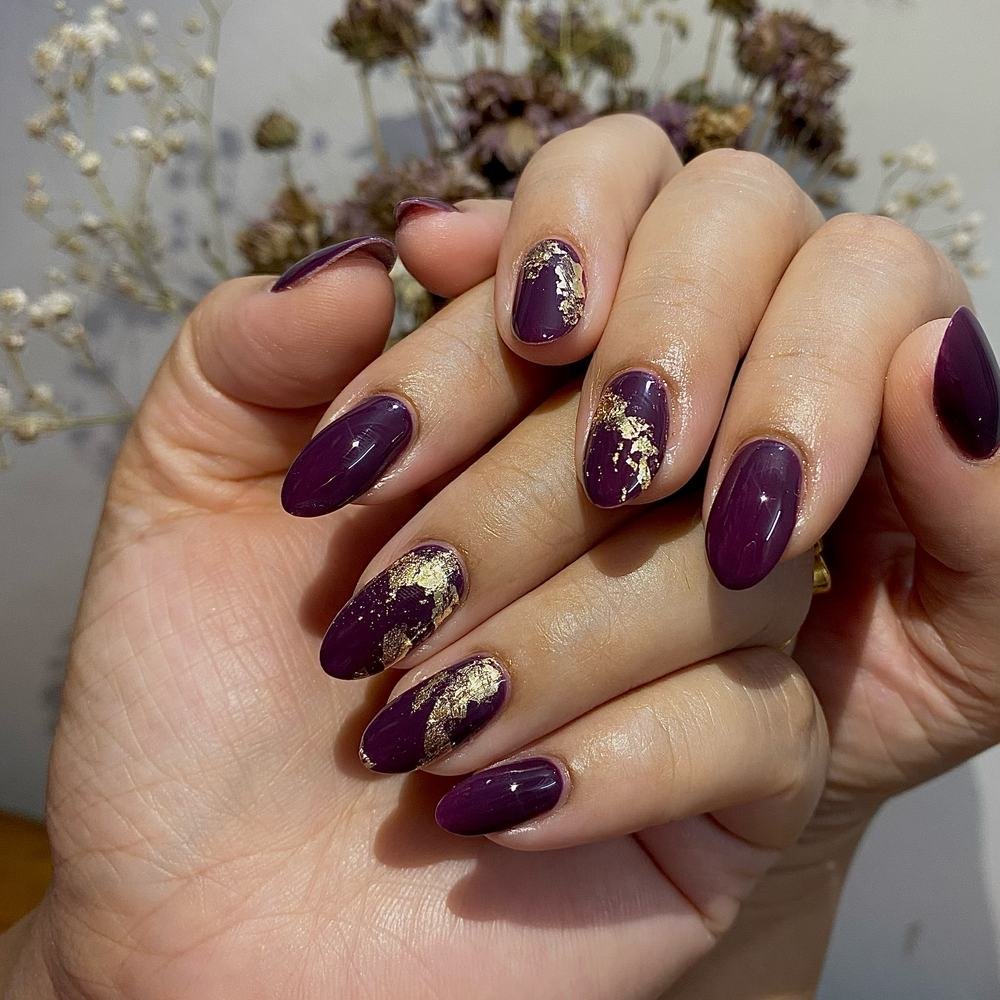 Deep Purple Almond Nails with Gold Foil Accents