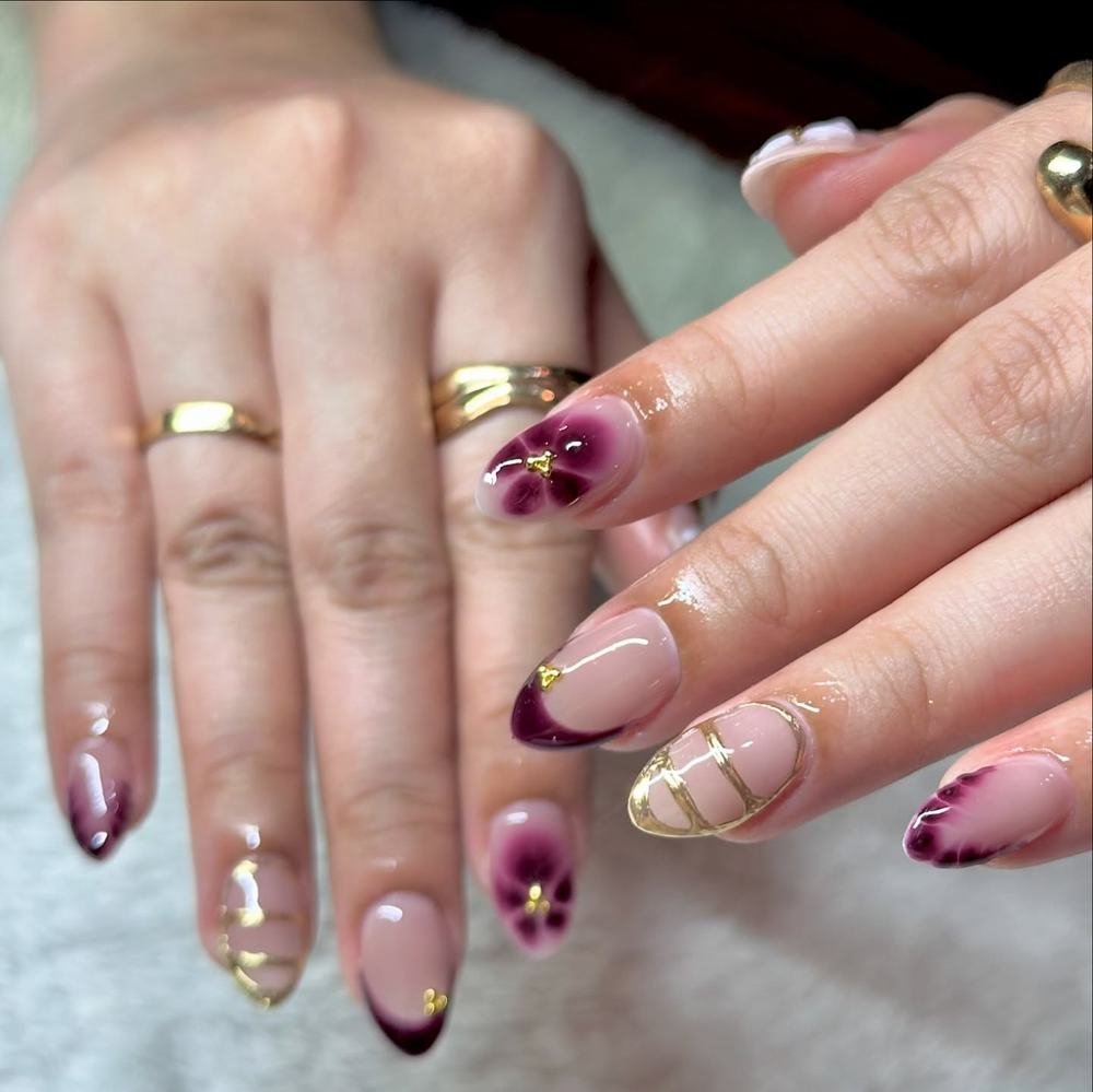 Mixed Purple, Pink, and Nude Almond Nails with Gold Details
