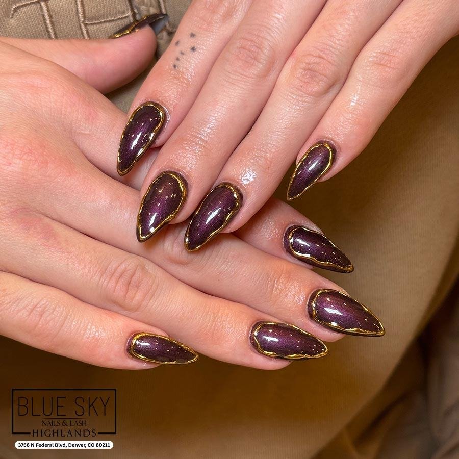 Purple Almond Nails with Gold and Black Abstract Accents