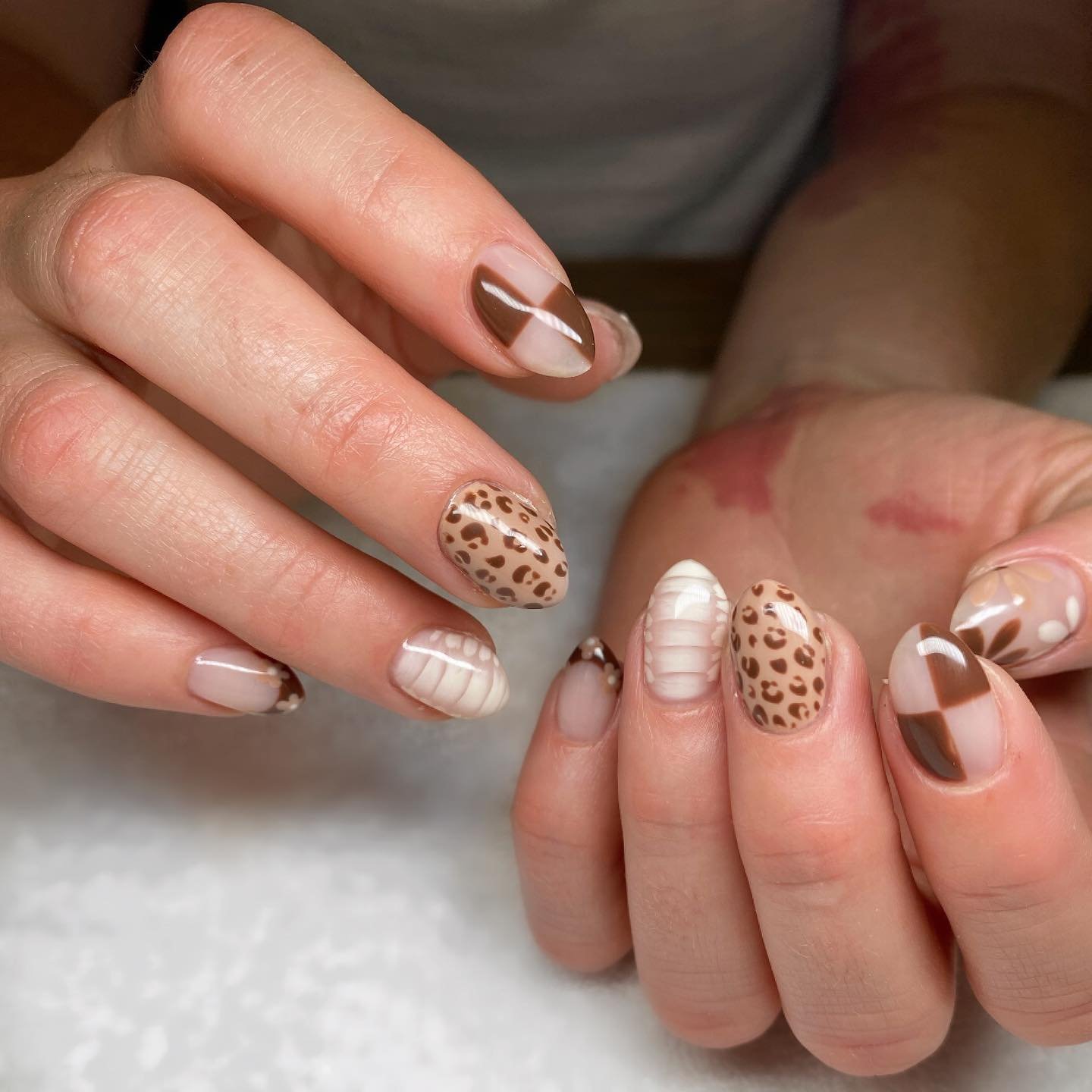 Nude Almond Nails with Brown Patterned Accents