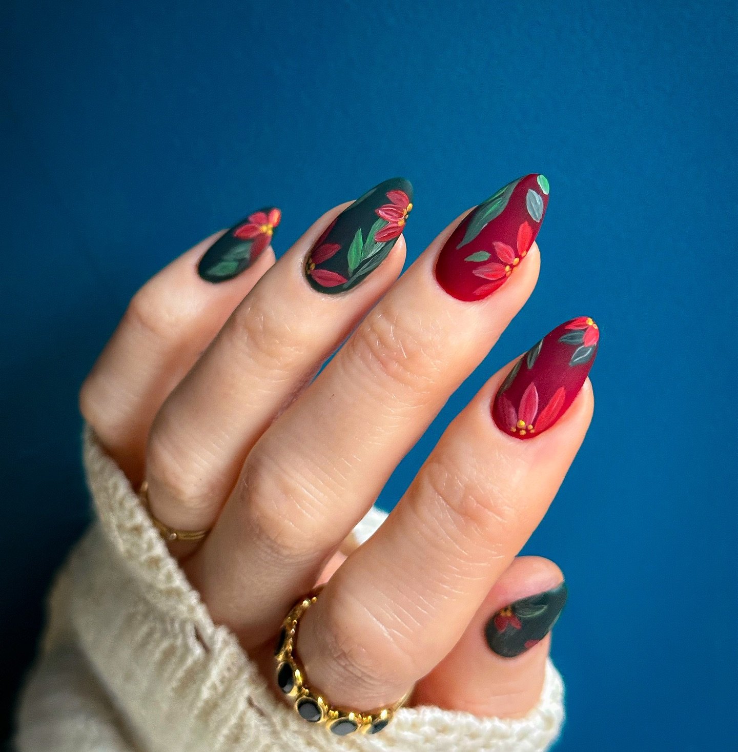 Glossy Red and Green Swirl Nails