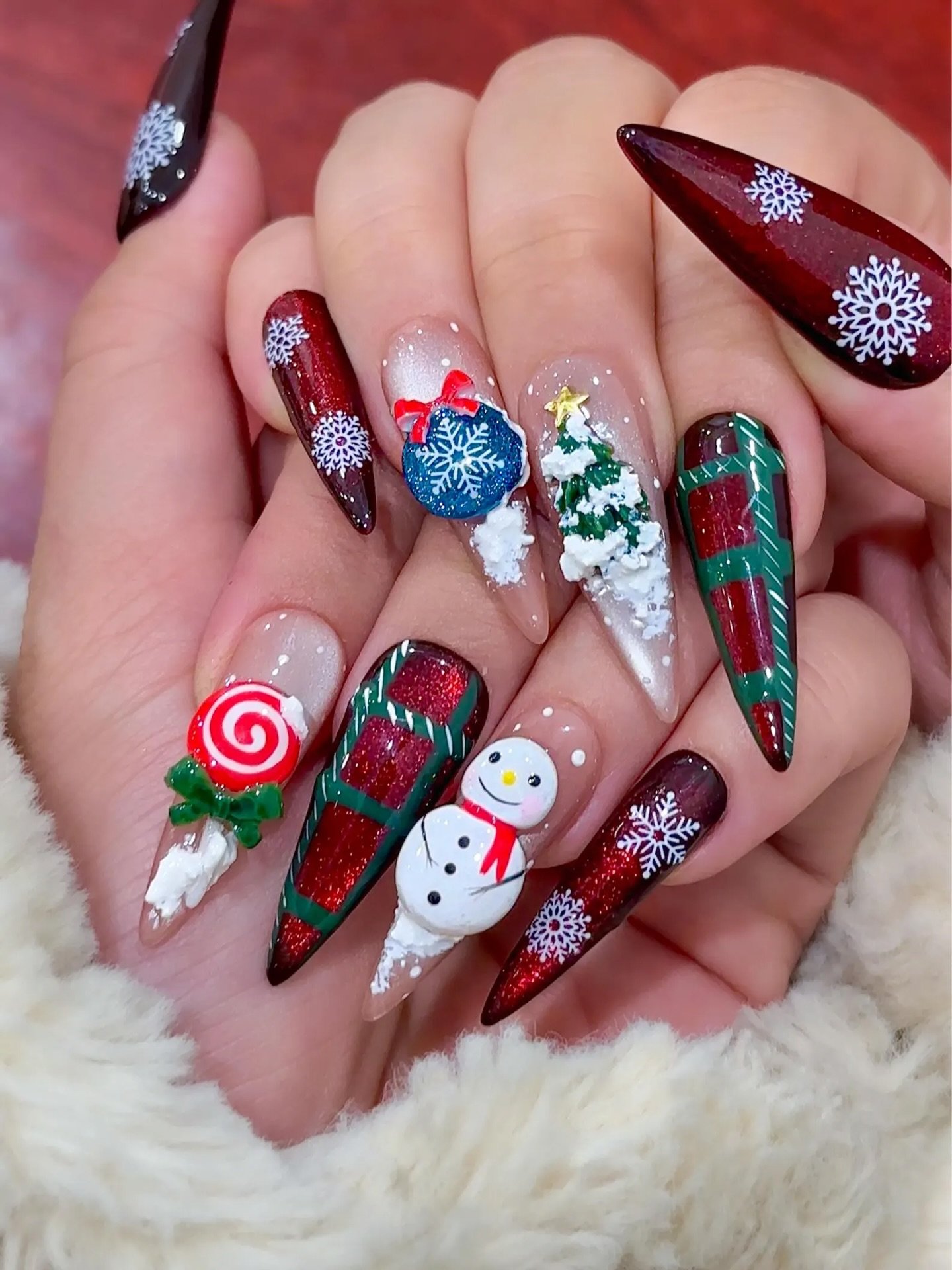 Colorful Christmas Stiletto Nails with Snowman and Candy Motifs
