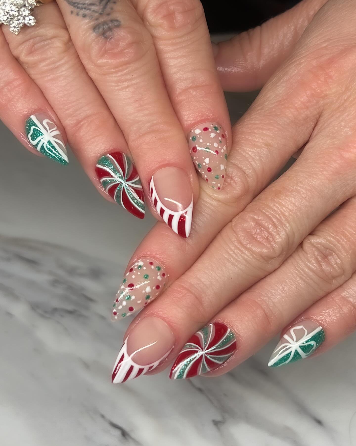 Red, Green, and White Christmas Nails with Candy-Cane Details