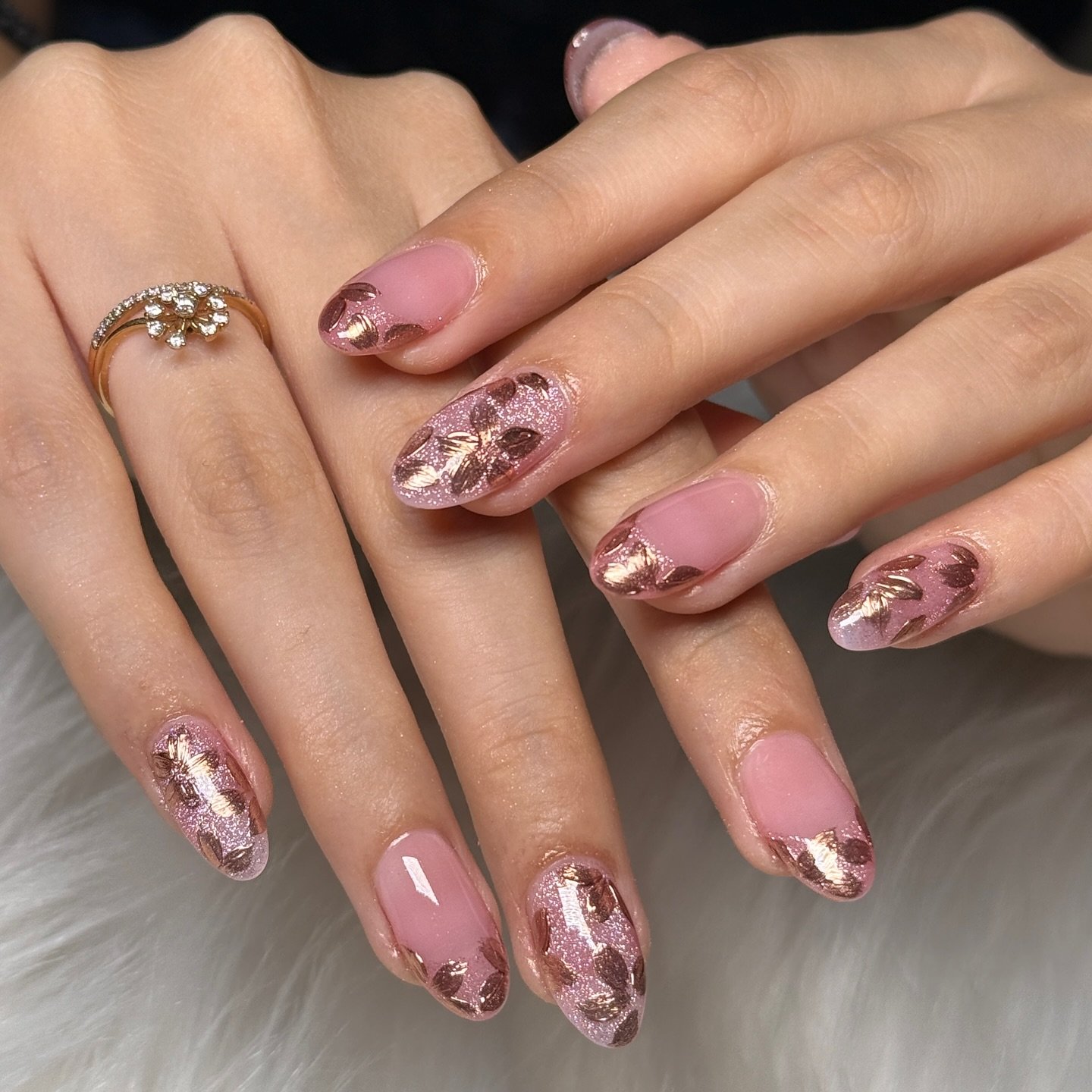 Glossy Pink Almond Nails with Rose Gold Foil Details