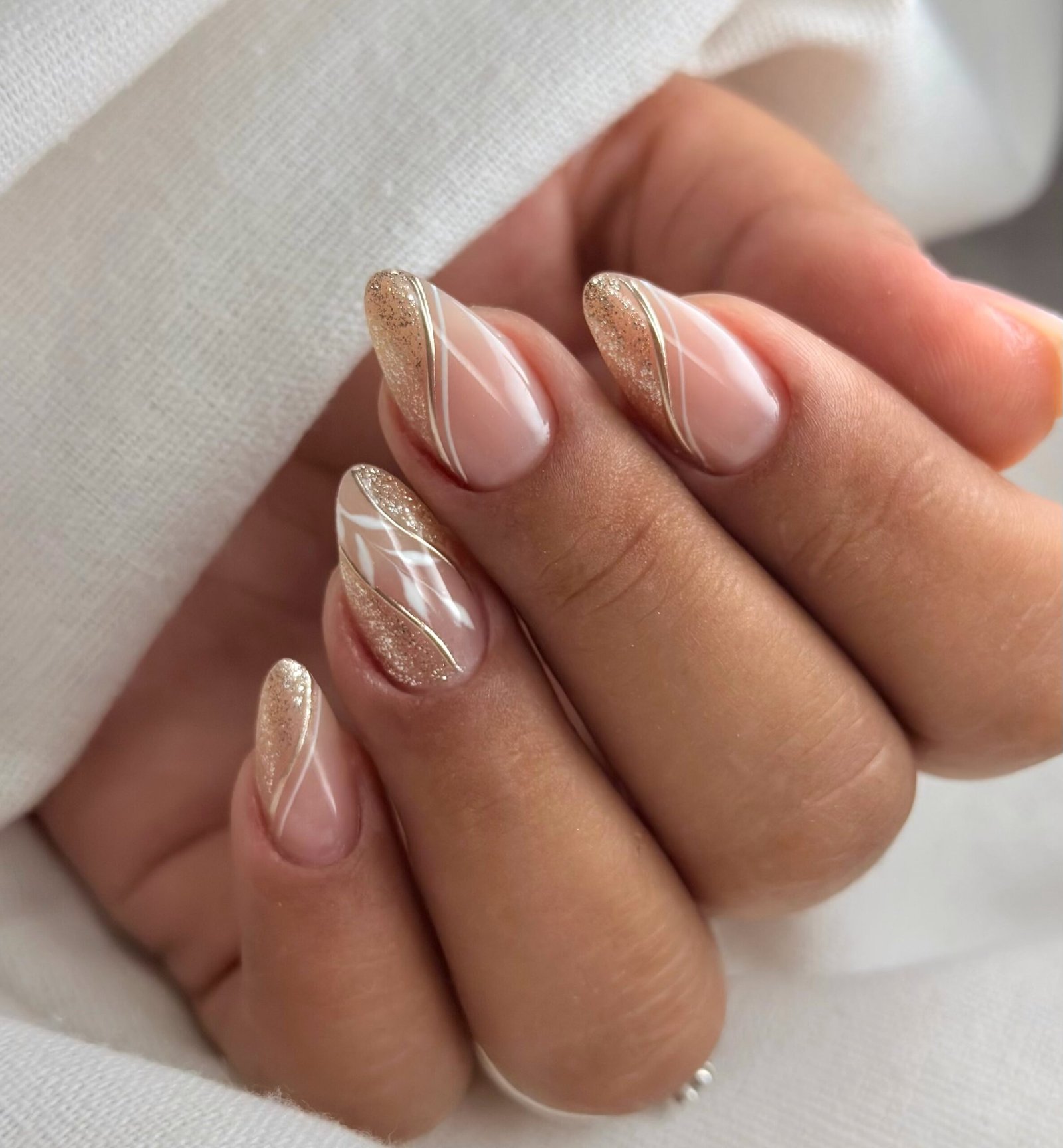 Soft Pink Almond Nails with Rose Gold Foil Marble Accents