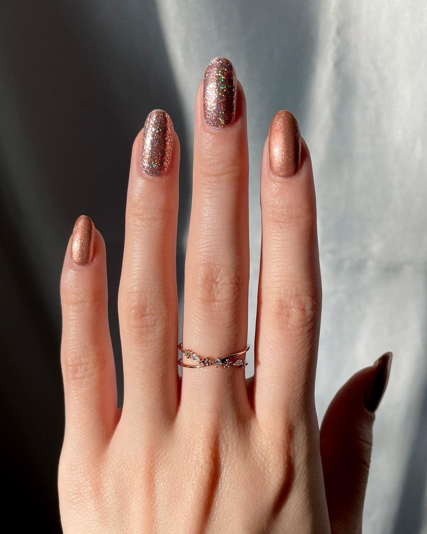 Long Nude Stiletto Nails with Rose Gold Metallic Tips