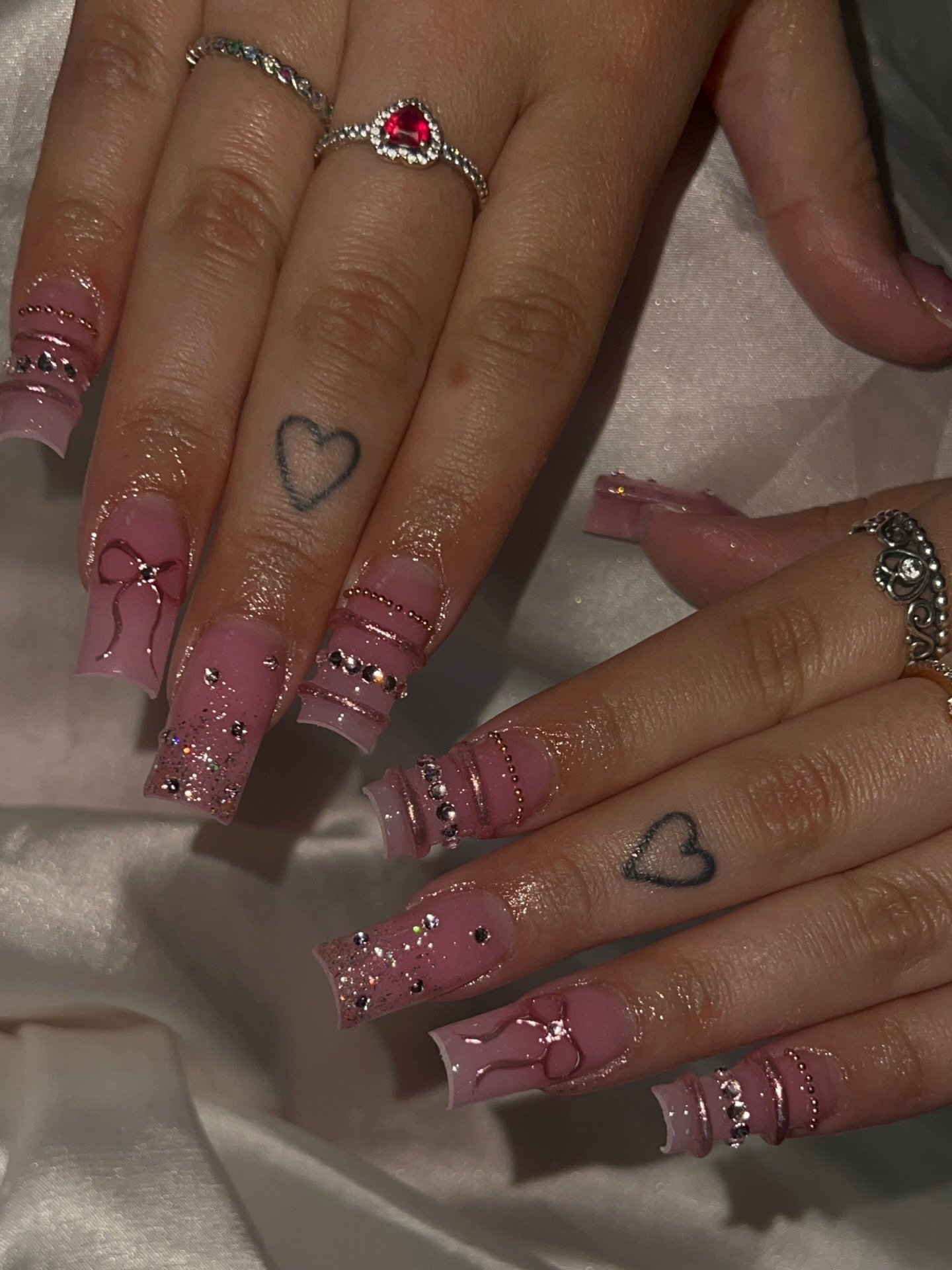 Pink Long Nails with Rose Gold Foil and Heart Details