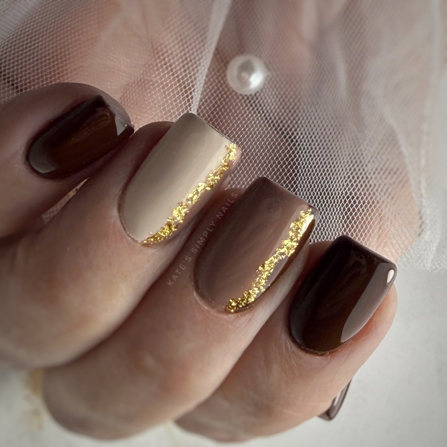 Short Brown Nails with Gold Glitter French-Style Edges