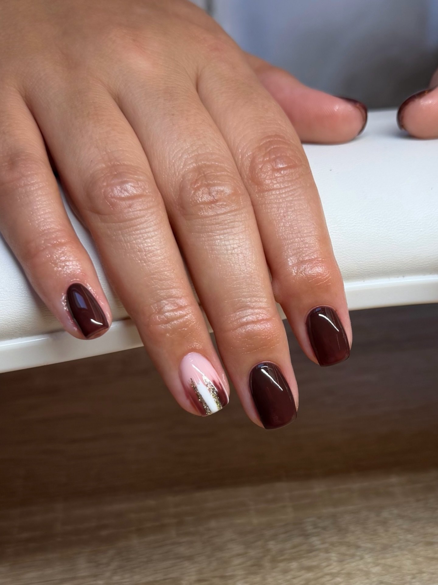 Short Brown Nails with a Pale Metallic Accent