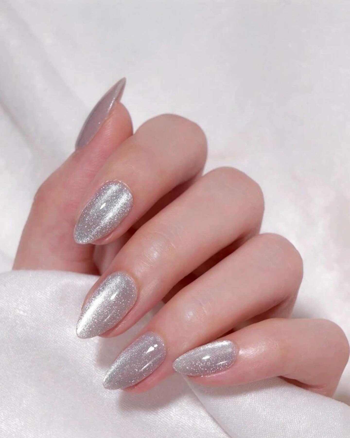 Silver Christmas nails idea 3: Long Almond Nails with a Full Silver Metallic Finish