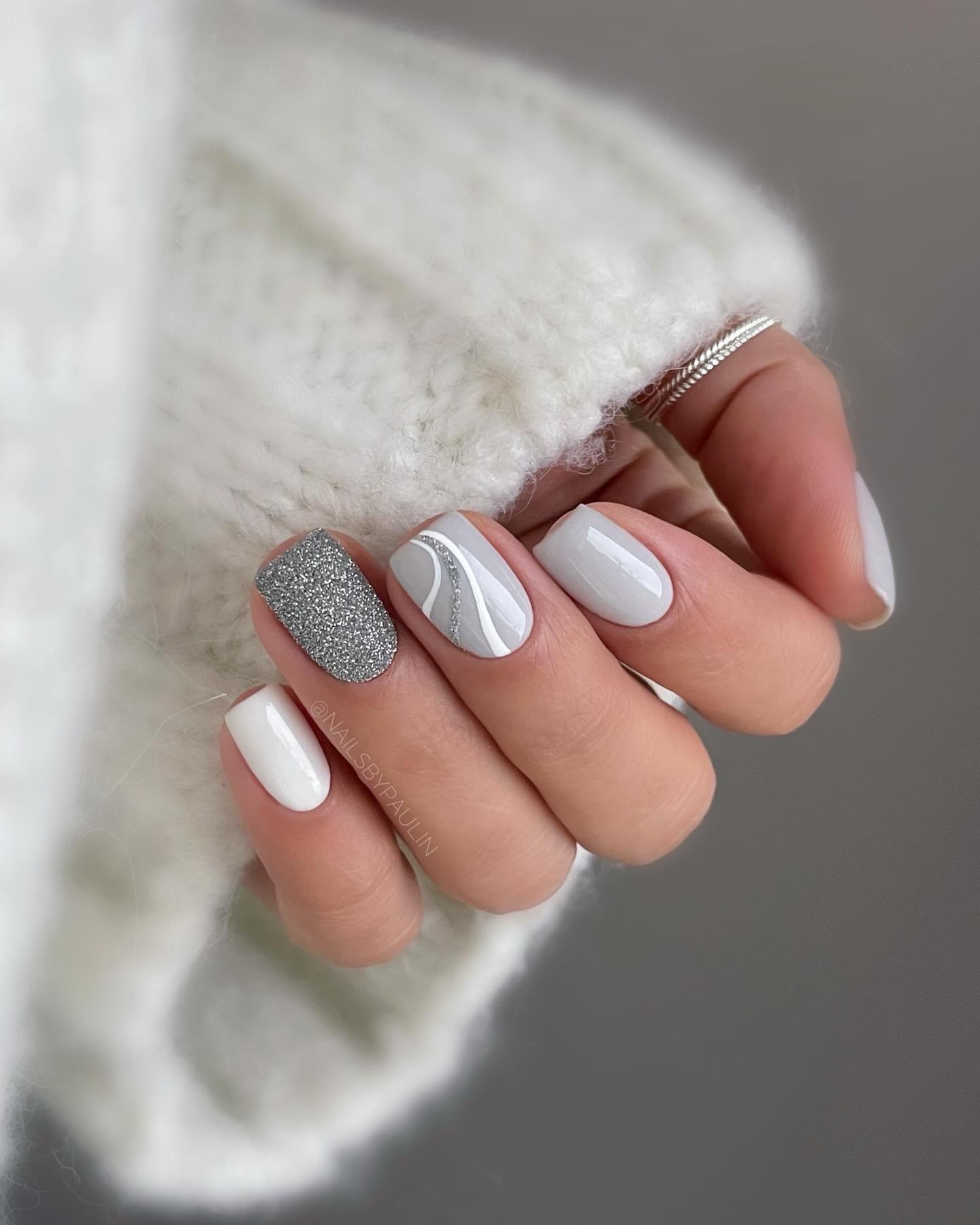 Silver Christmas nails idea 5: Short White Nails with a Silver Glitter Accent