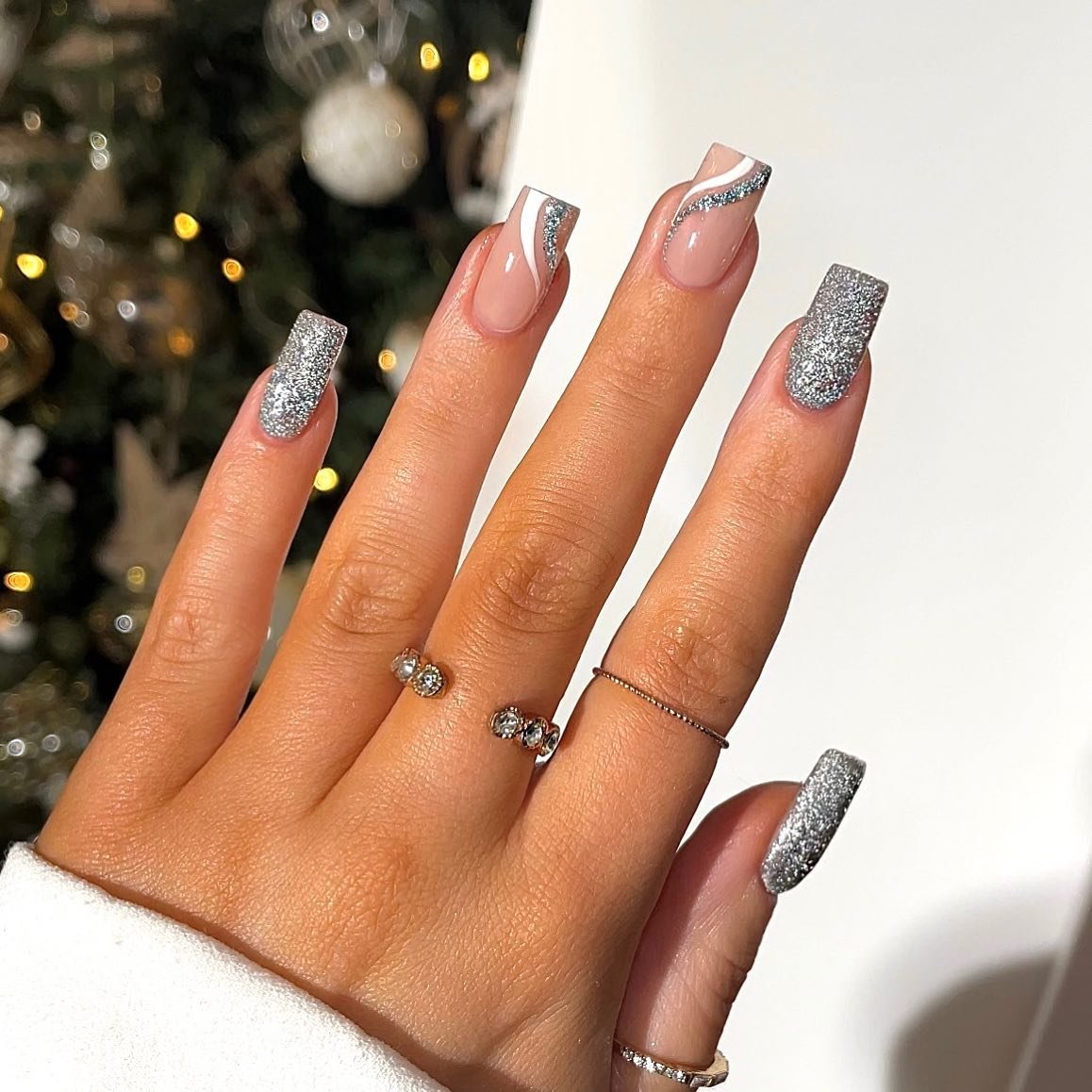 Silver Christmas nails idea 8: Long Nails with Silver Glitter and Metallic French Tips