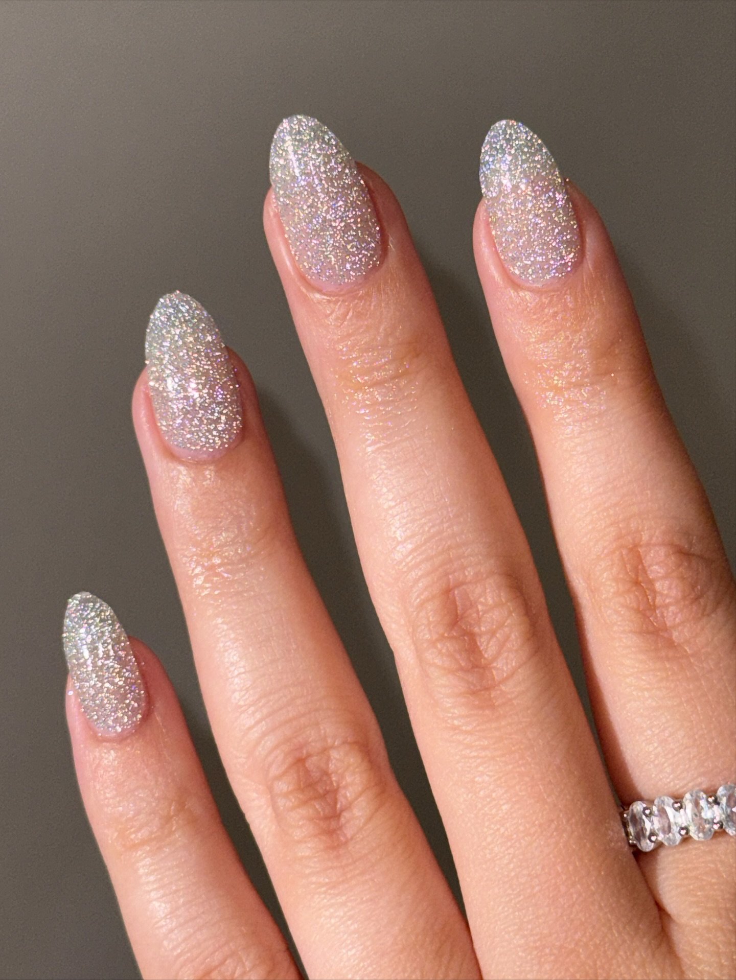 Silver Christmas nails idea 9: Short Oval Nails with Fine Silver Glitter