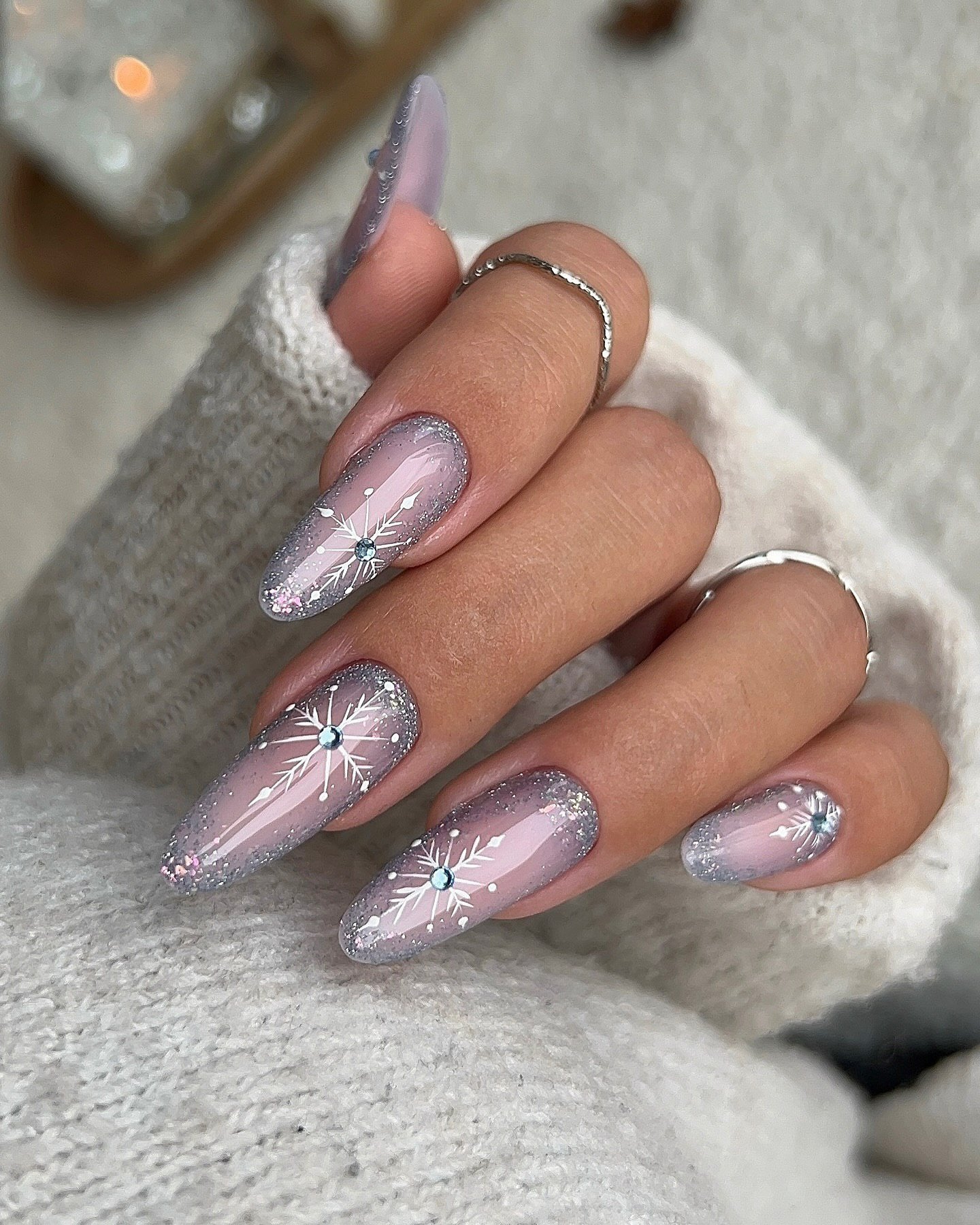 Silver Christmas nails idea 12: Lavender Almond Nails with Silver Starburst Accents