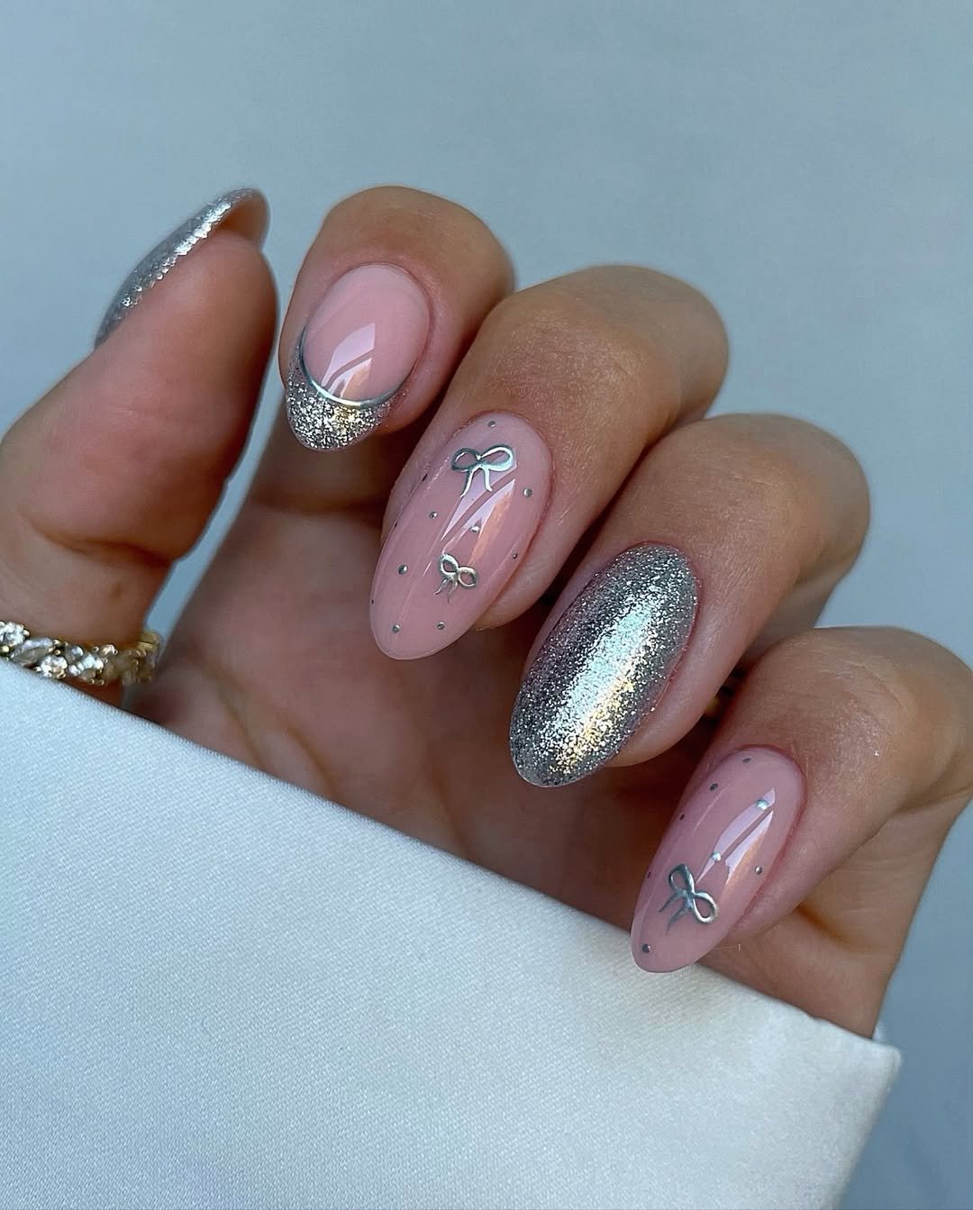 Silver Christmas nails idea 17: Pink Nails with Silver Glitter and Delicate Line Details