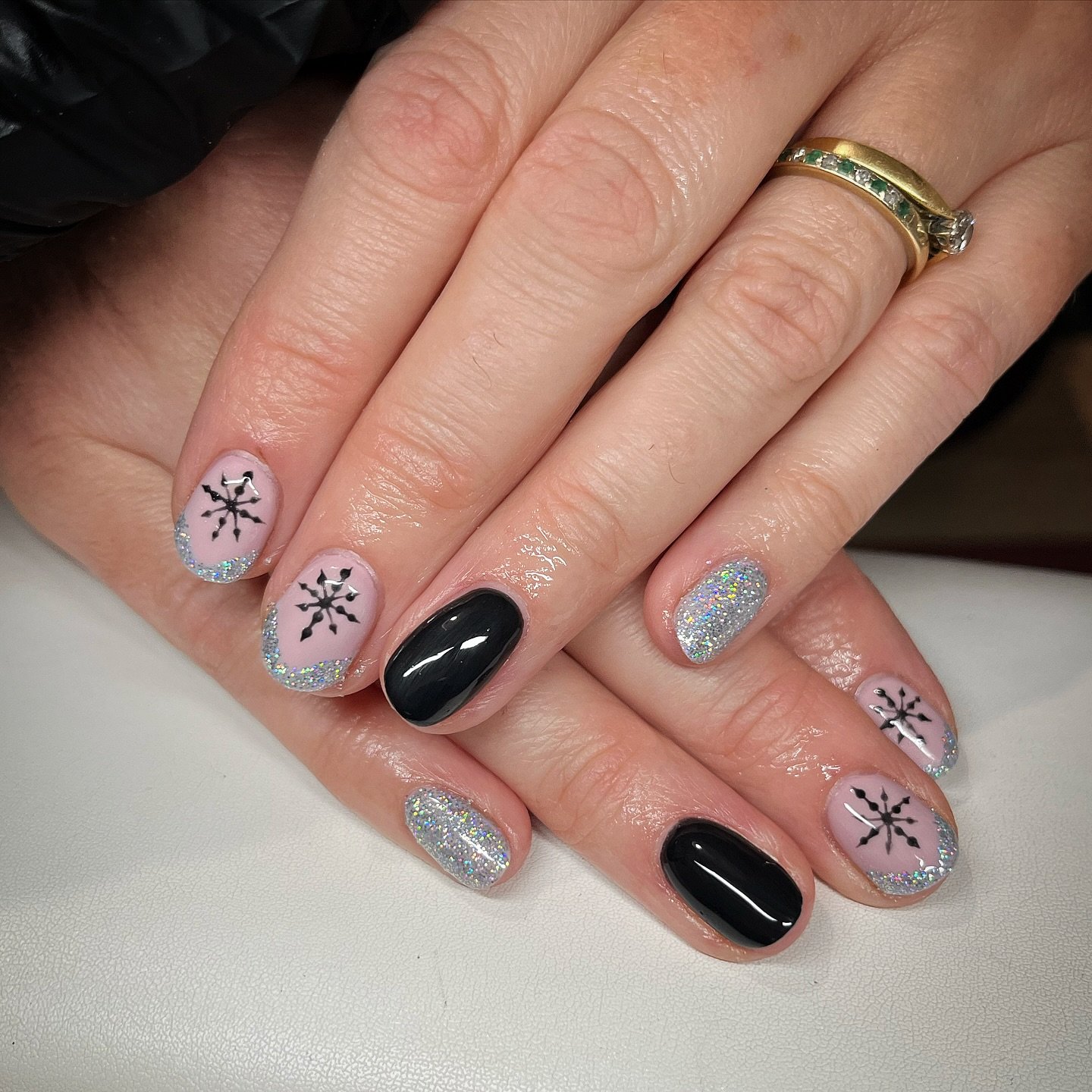 Silver Christmas nails idea 22: Pink and Black Nails with Snowflake and Silver Glitter Accents