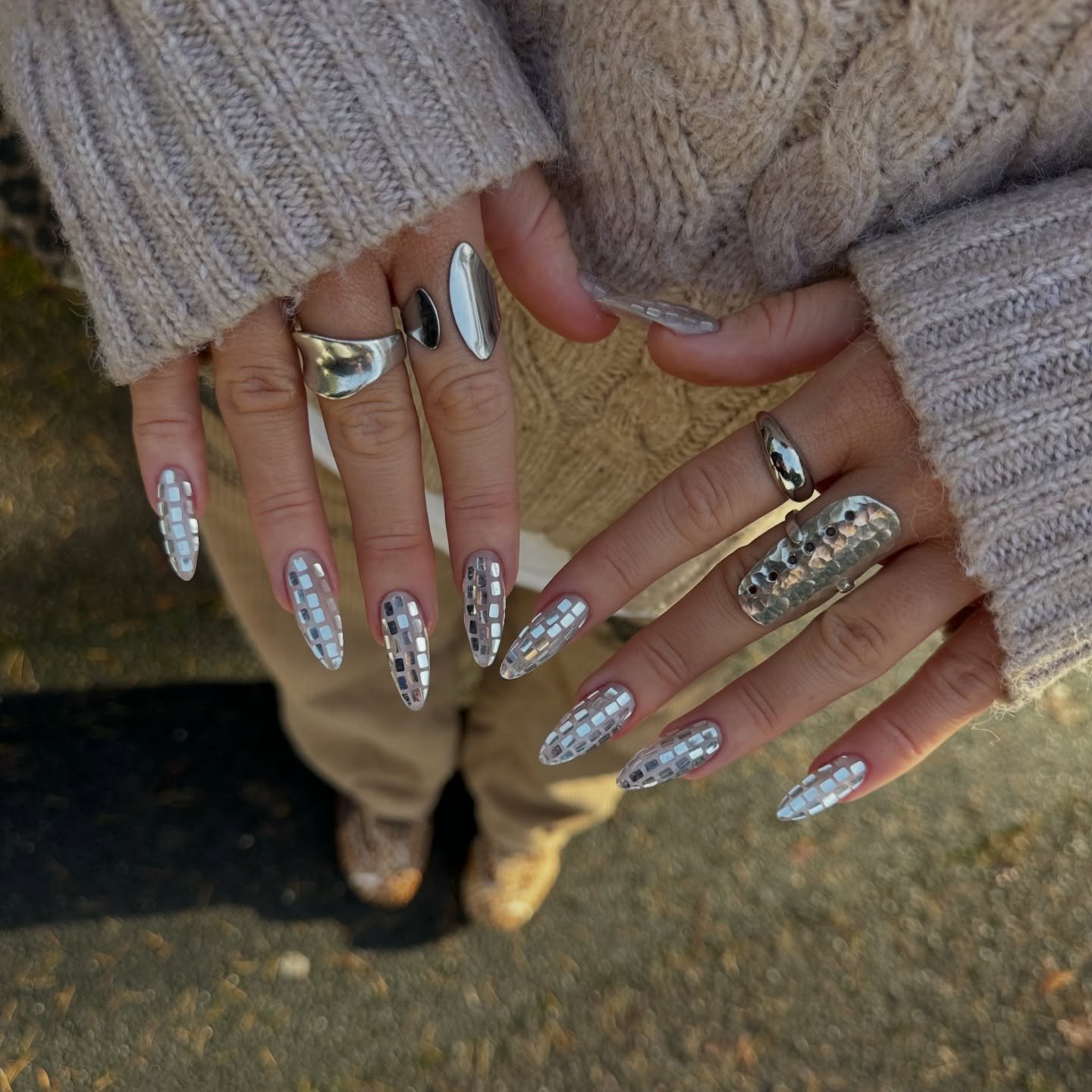 Silver Christmas nails idea 31: Long Silver Glitter Nails with Mixed Metallic Details