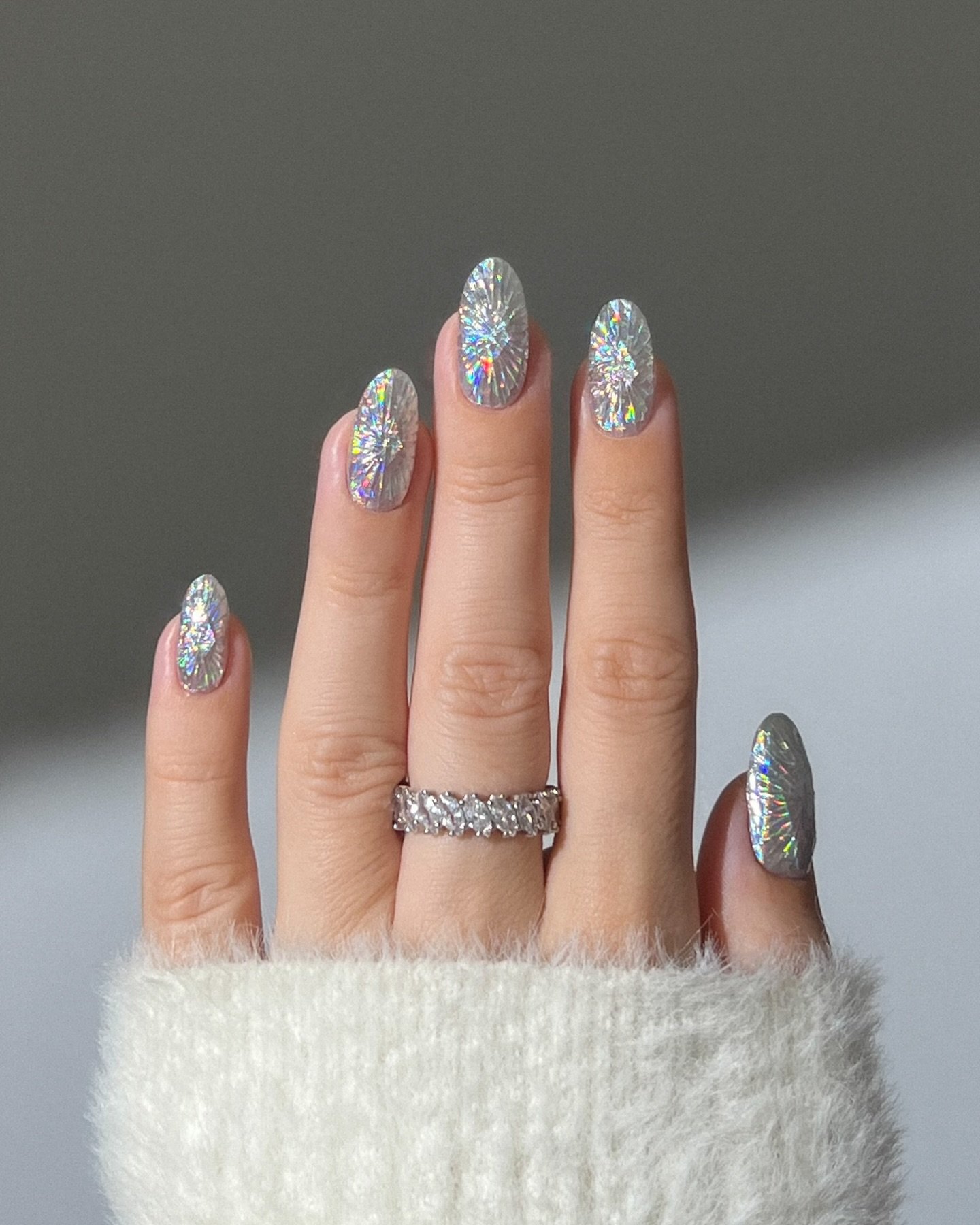 Silver Christmas nails idea 32: Long Almond Nails with Silver Glitter Texture