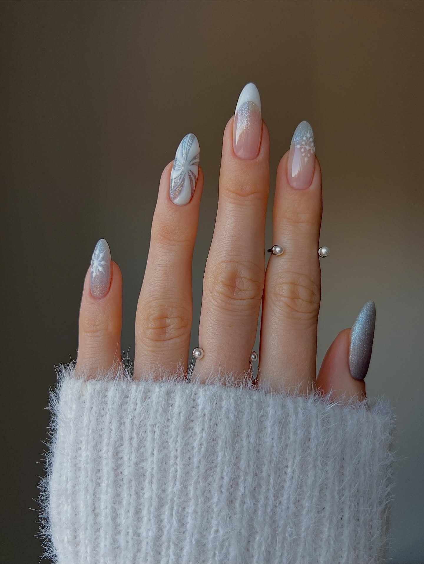 Silver Christmas nails idea 37: Long Almond Nails with Silver and Blue-Gray Accents