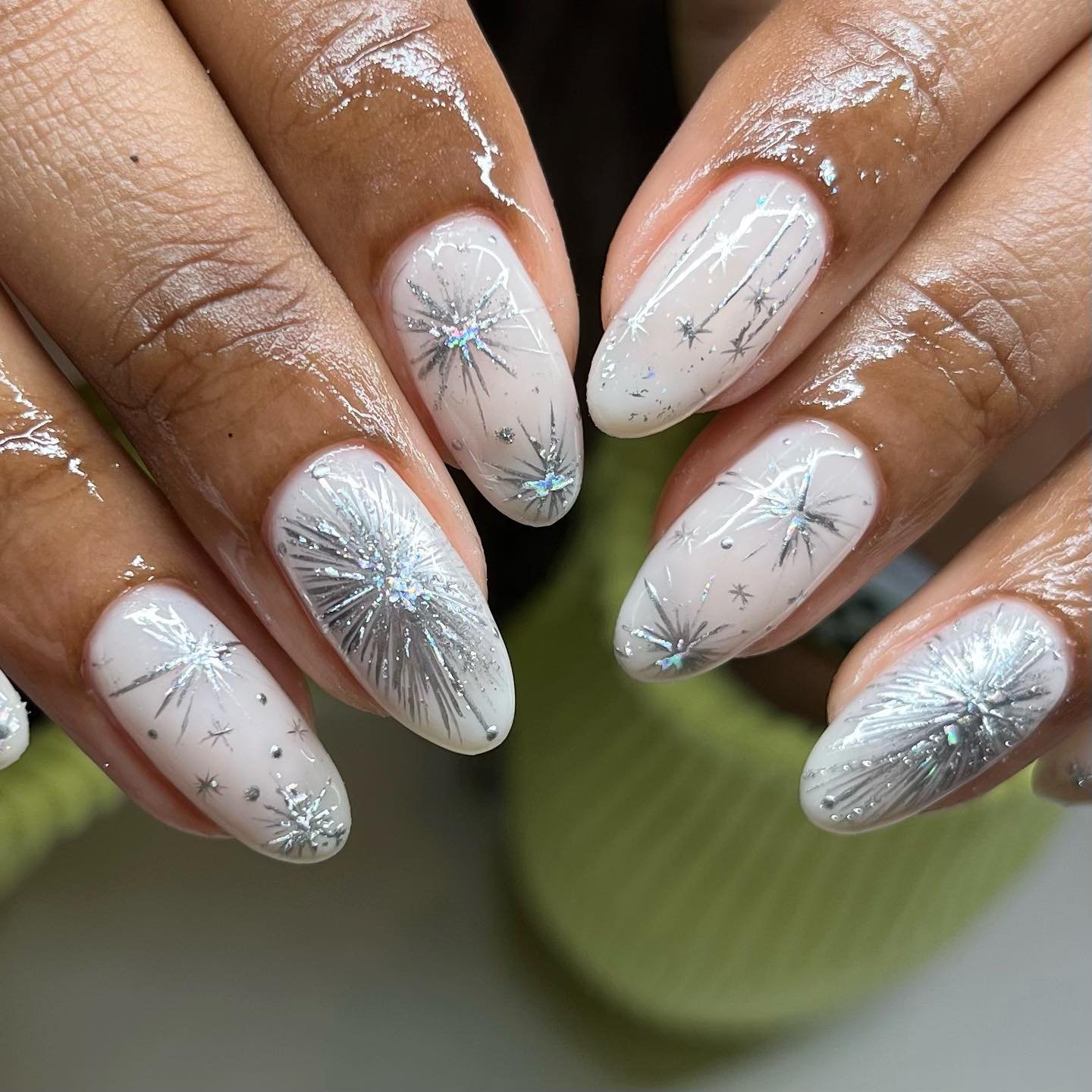 Silver Christmas nails idea 38: White Nails with Silver Starburst and Glitter Details