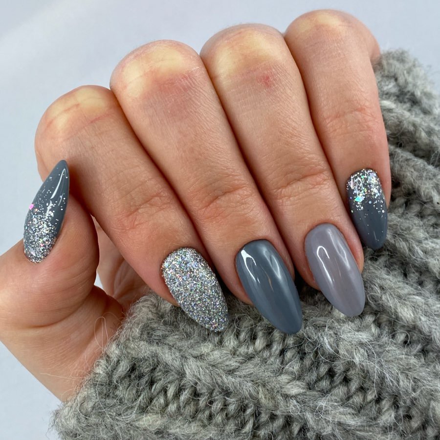 Silver Christmas nails idea 41: Gray-Blue Nails with Silver Glitter Accents