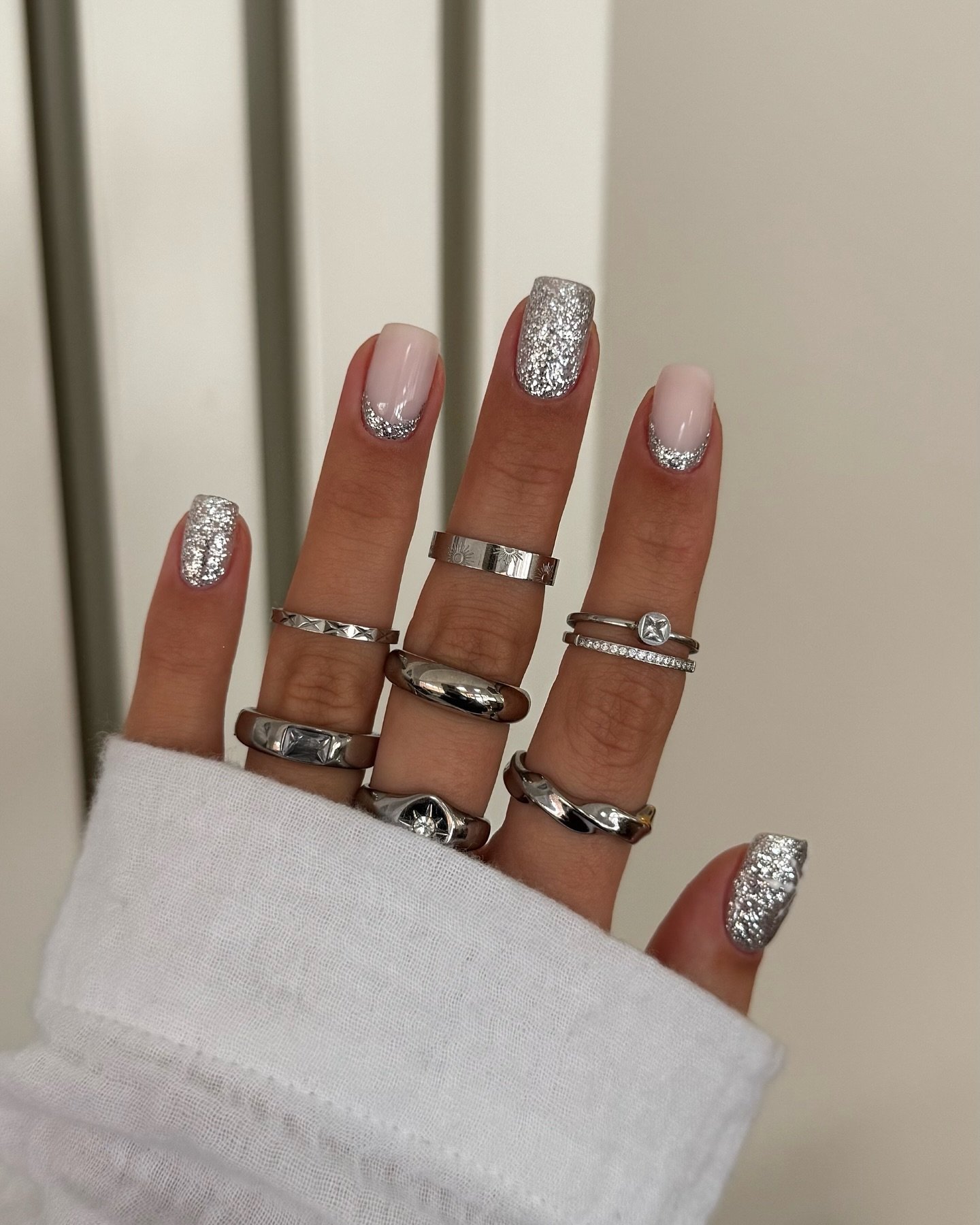 Silver Christmas nails idea 42: Blush Nails with Silver Glitter and Minimal Details