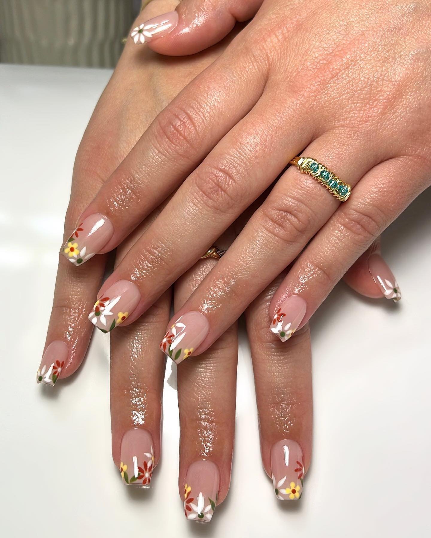 Nude Coffin Nails with Delicate Floral Accents