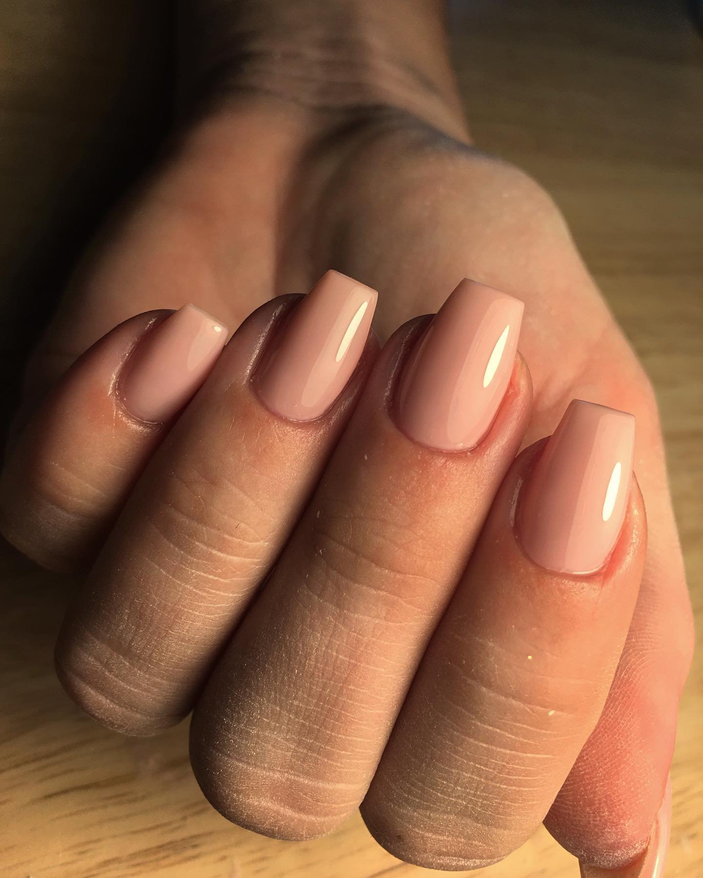 Warm Nude Coffin Nails with a Glossy Finish
