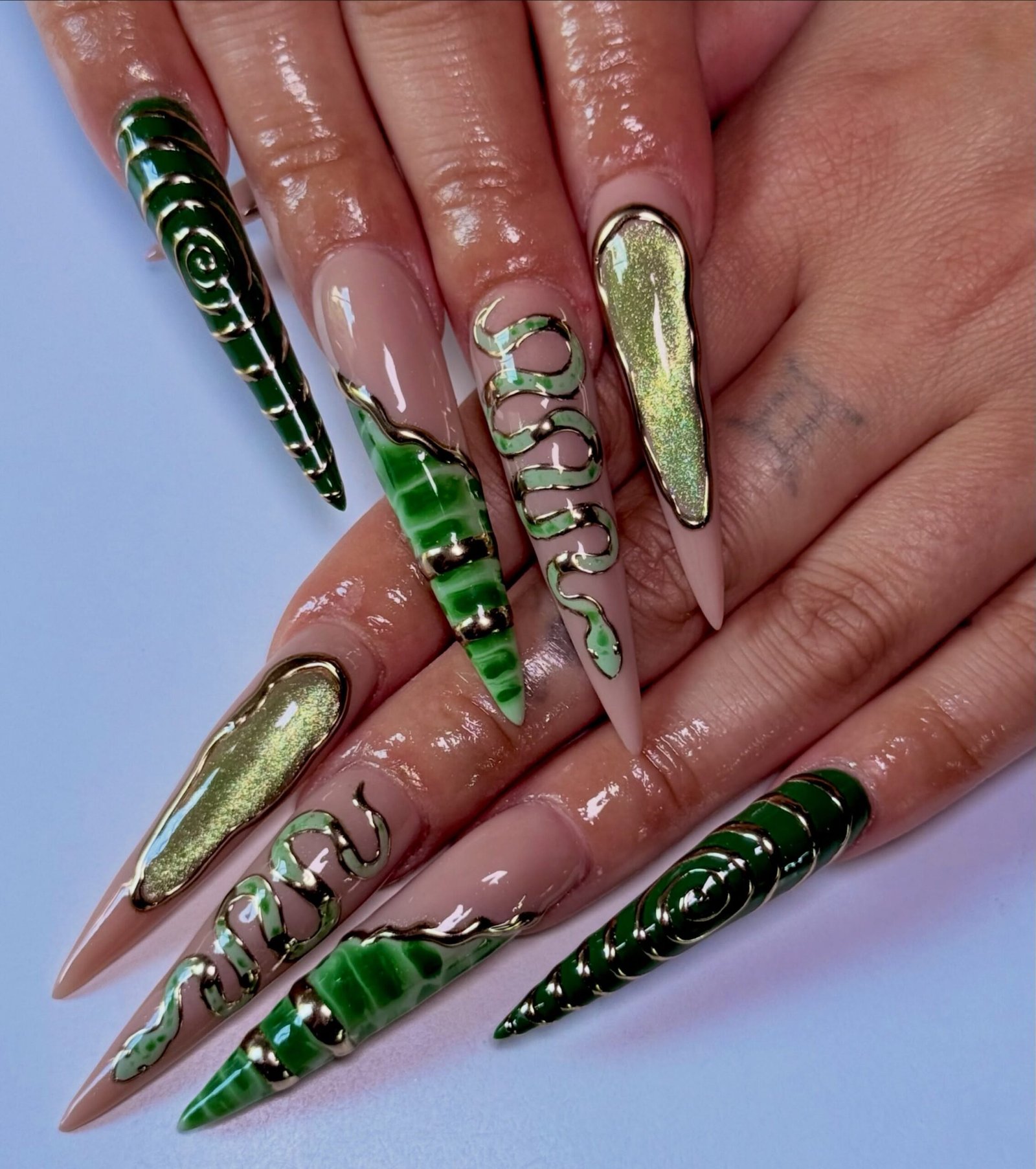 Green Snakeskin Stiletto Nails with Metallic Accents