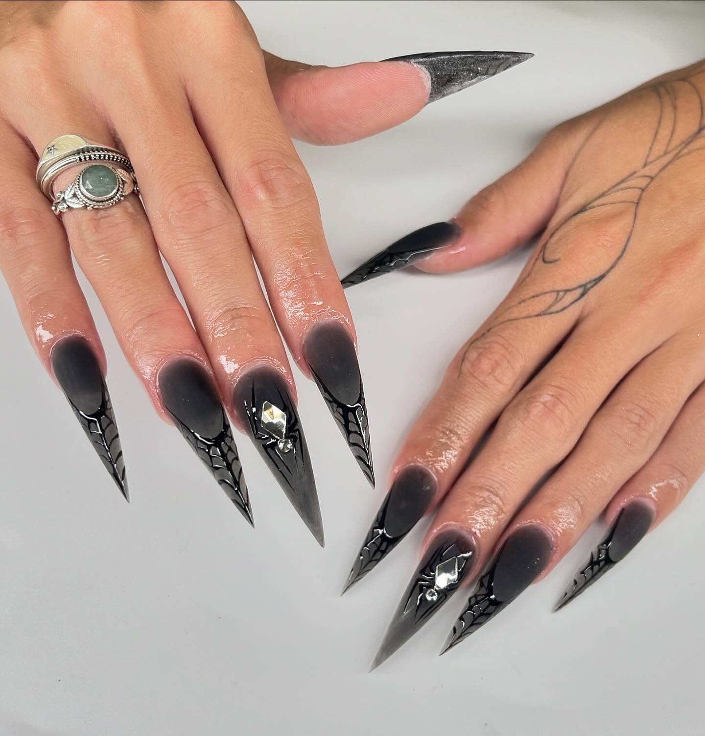 Black Stiletto Nails with Silver Spider Web Lines