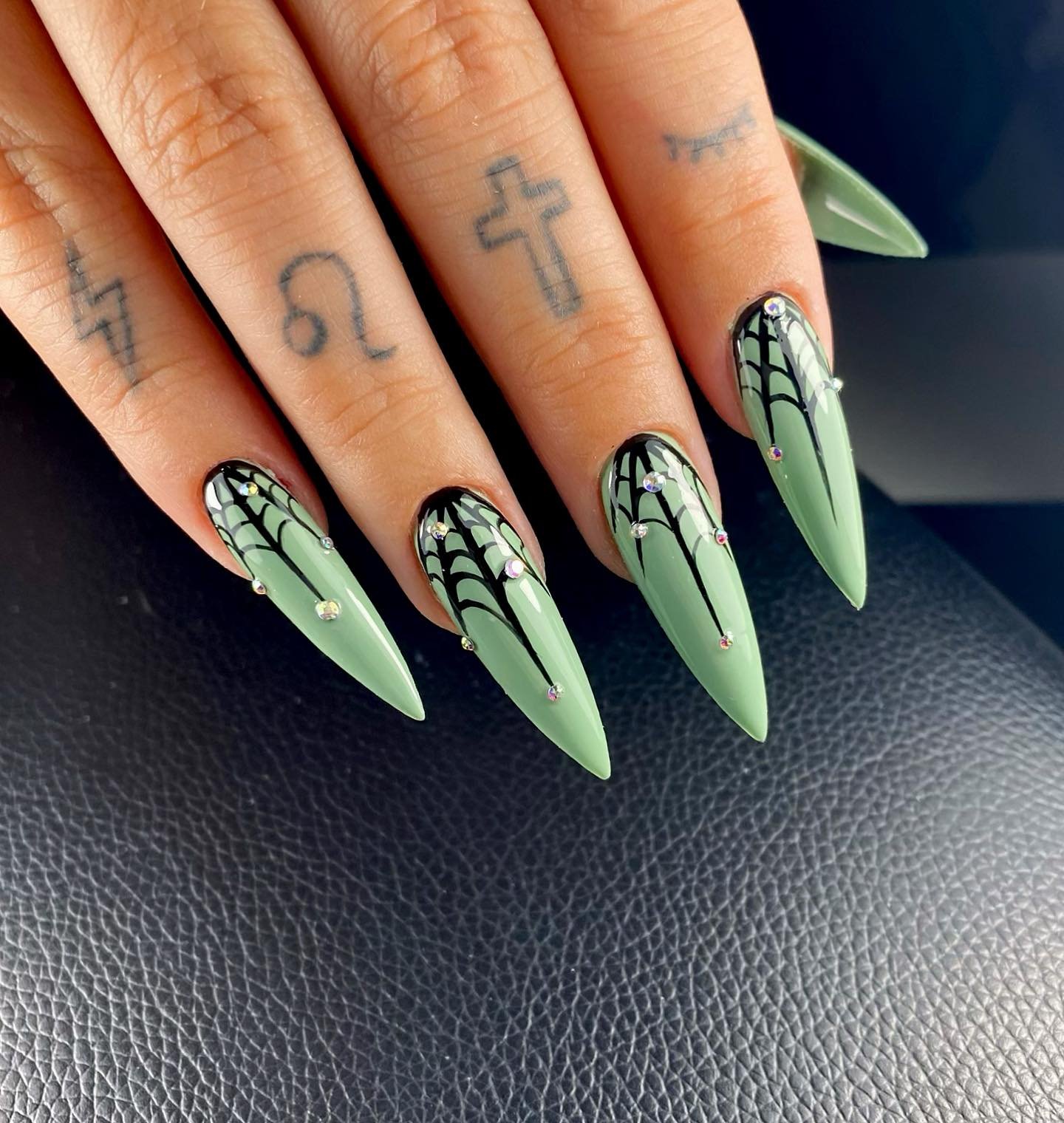Pale Green Stiletto Nails with Black Webs