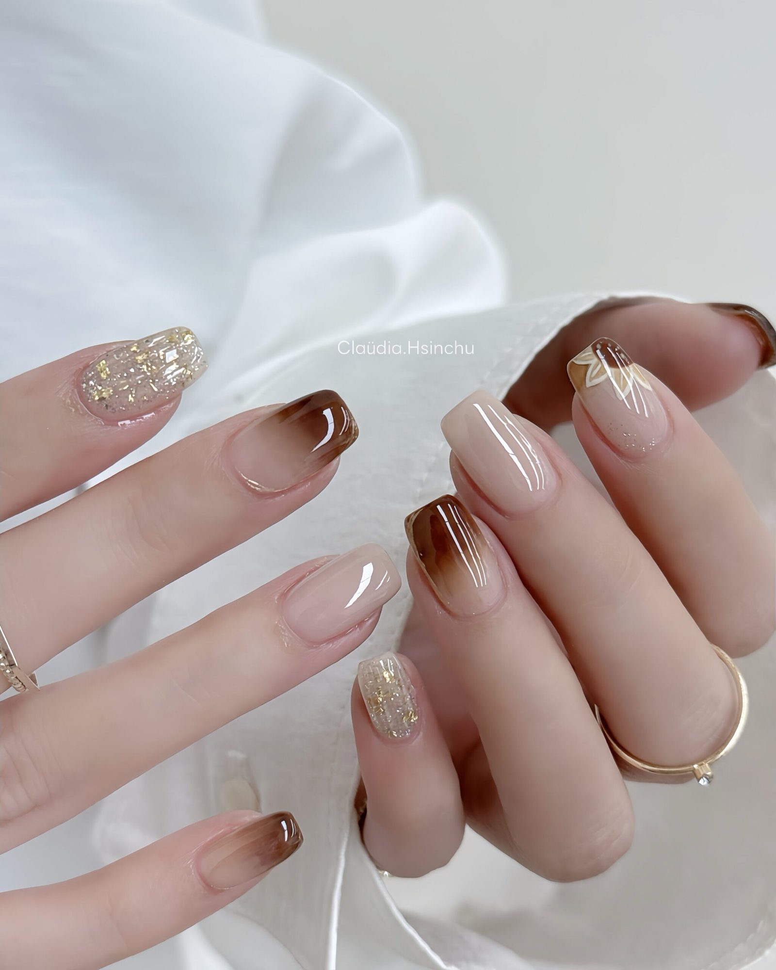 Sheer Taupe Nails with White and Gold Accents
