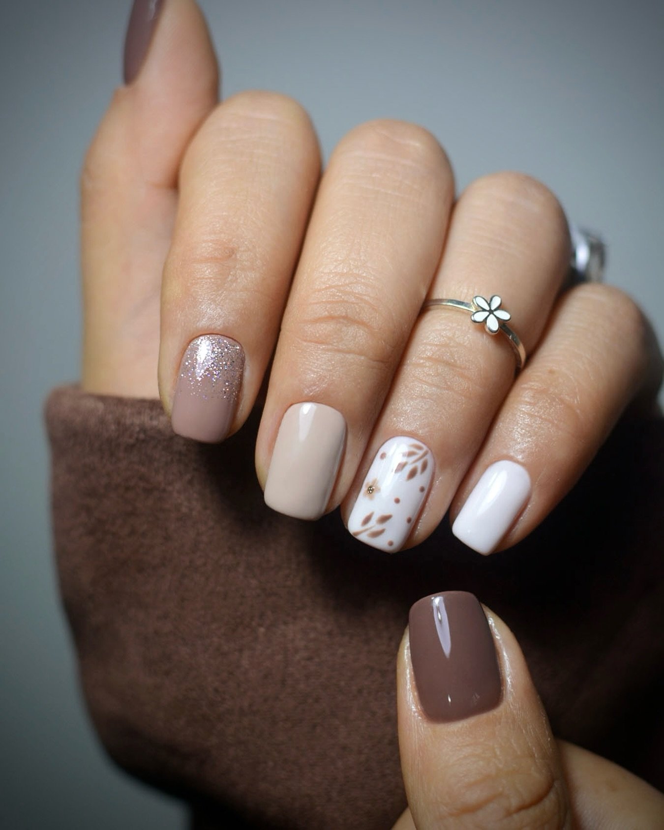 Short Taupe Nails with White and Brown Accents