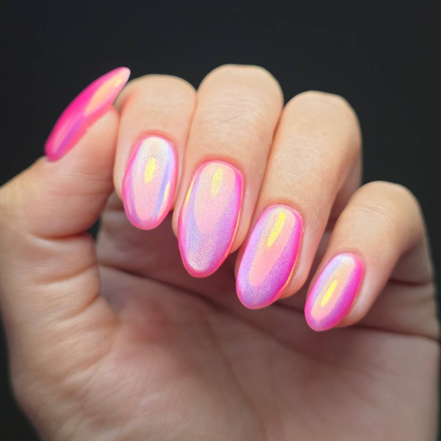 Medium almond nails have a soft pink base with thin white outline accents that follow the nail shape.
