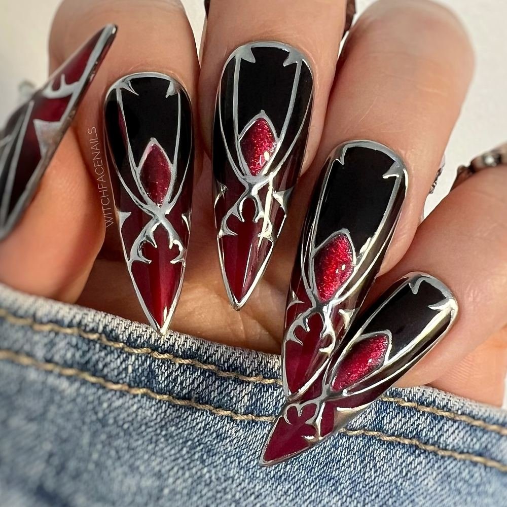 Black Stiletto Nails with White and Red Graphic Details