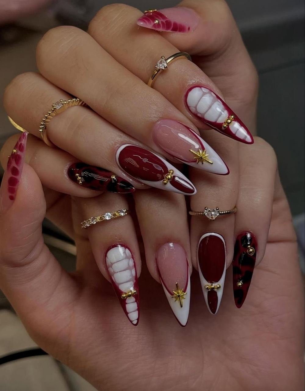 Pink and Burgundy Almond Nails with White and Gold Details