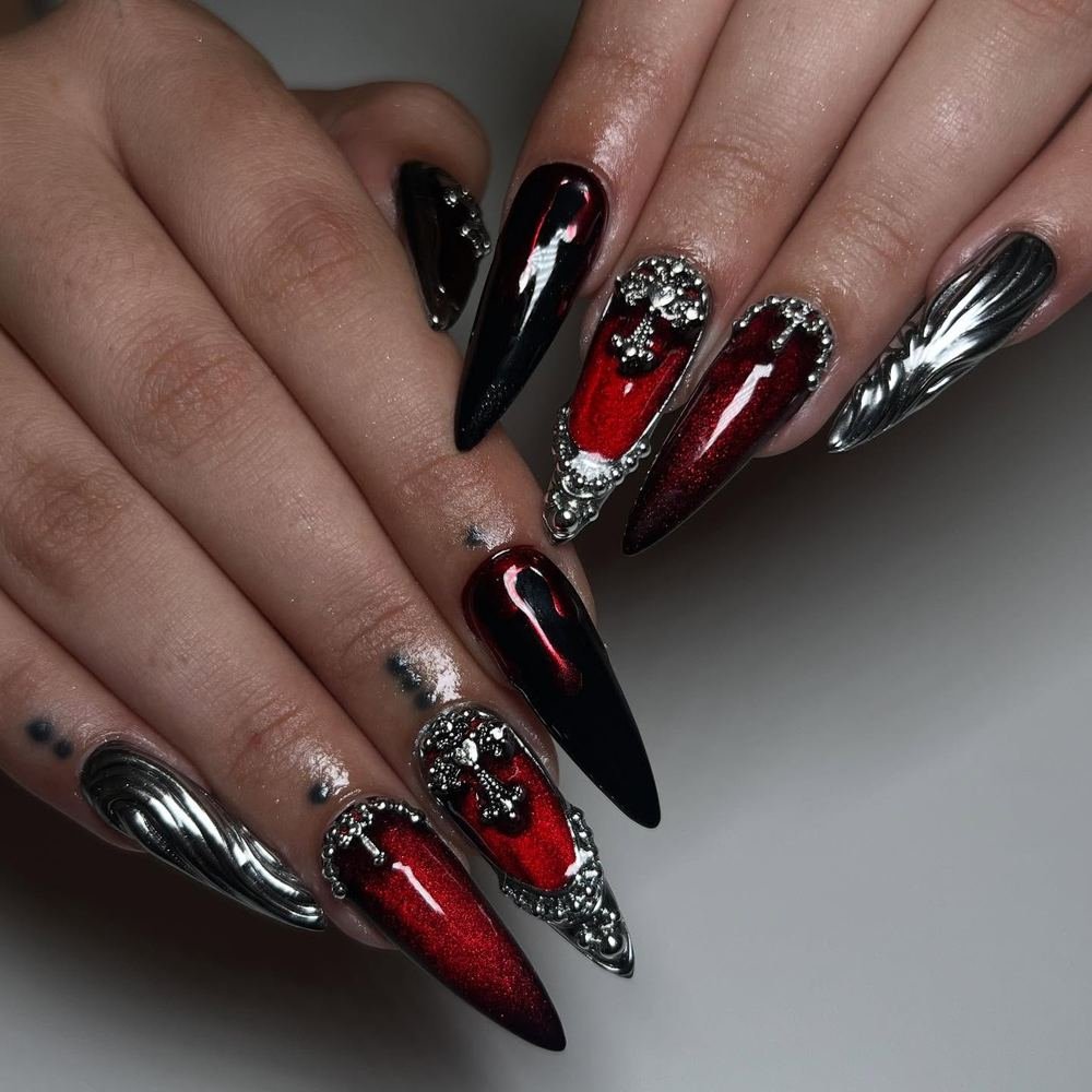 Black and Red Stiletto Nails with Silver Embellishments