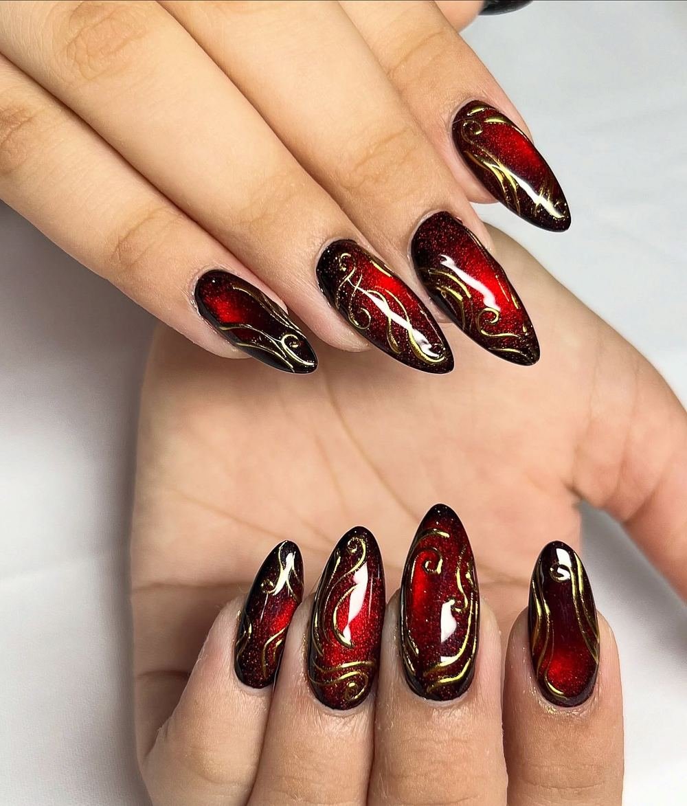 Deep Red Nails with Gold and Light Metallic Swirls