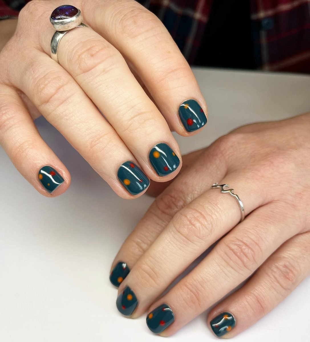 Short Teal Nails with Tiny Orange Accents