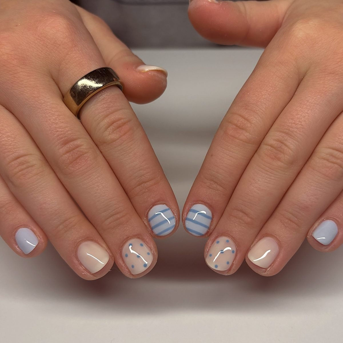 Soft Nude Nails with Blue and Speckled Accents