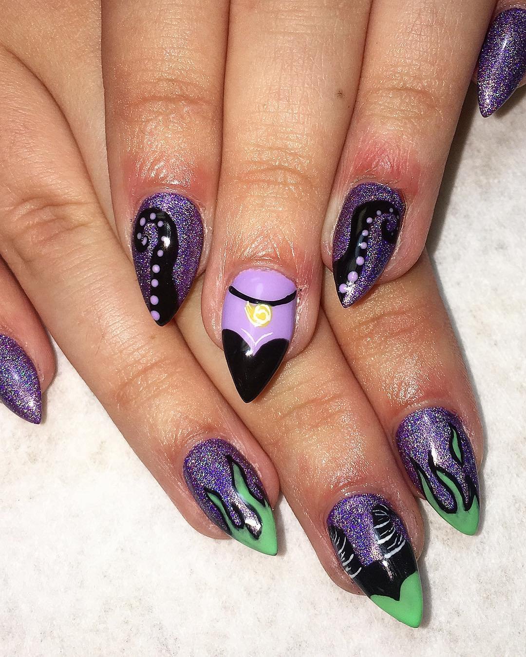 Purple and Black Almond Nails with Green Graphic Accents