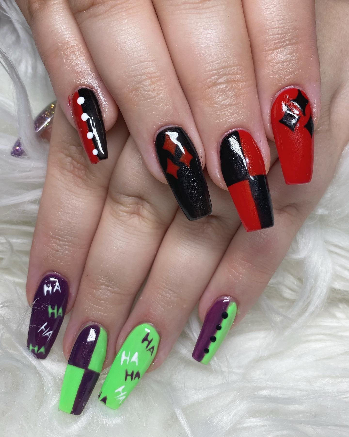 Black and Red Graphic Nails with Bright Green Accents