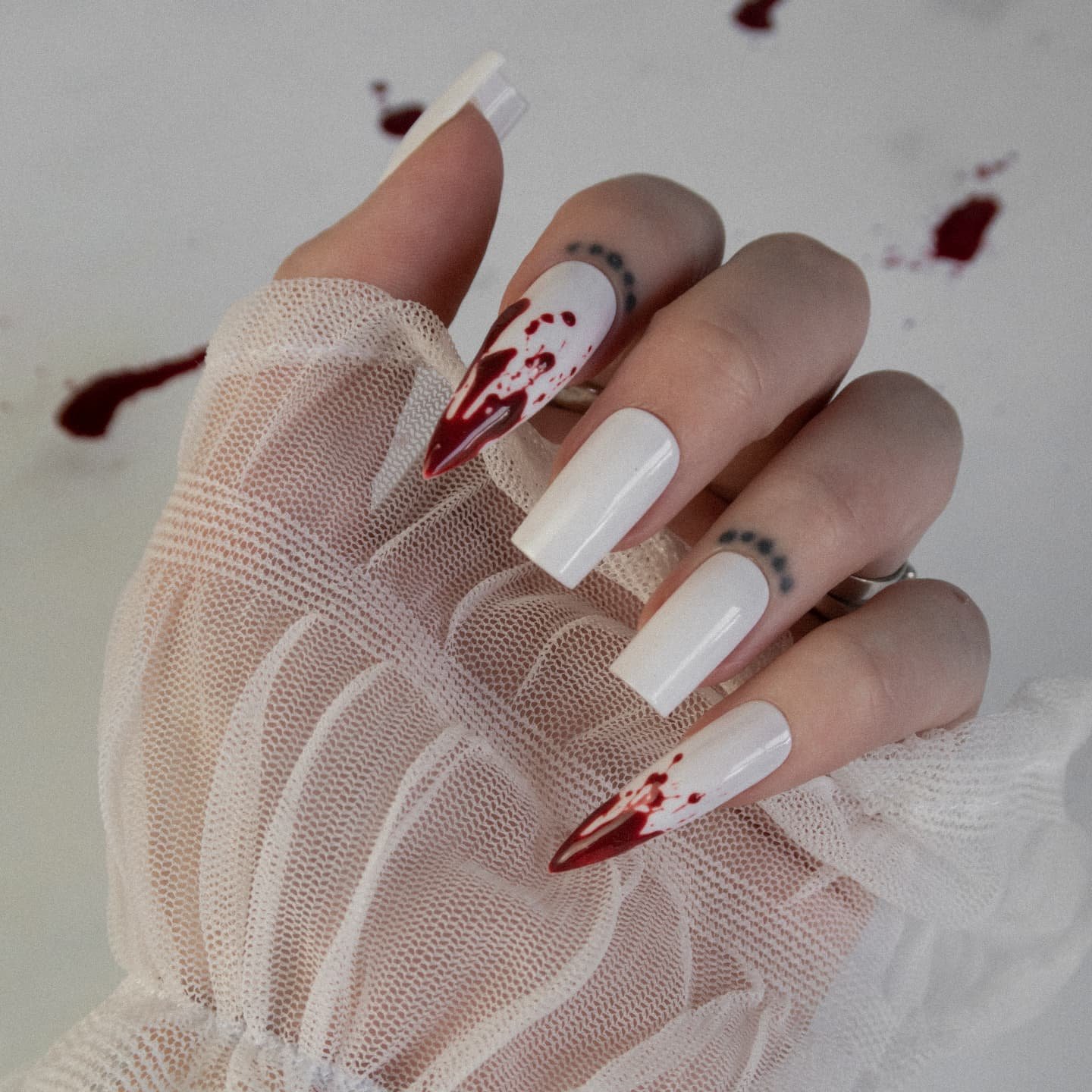 White Nails with Fine Red Character and Line Art