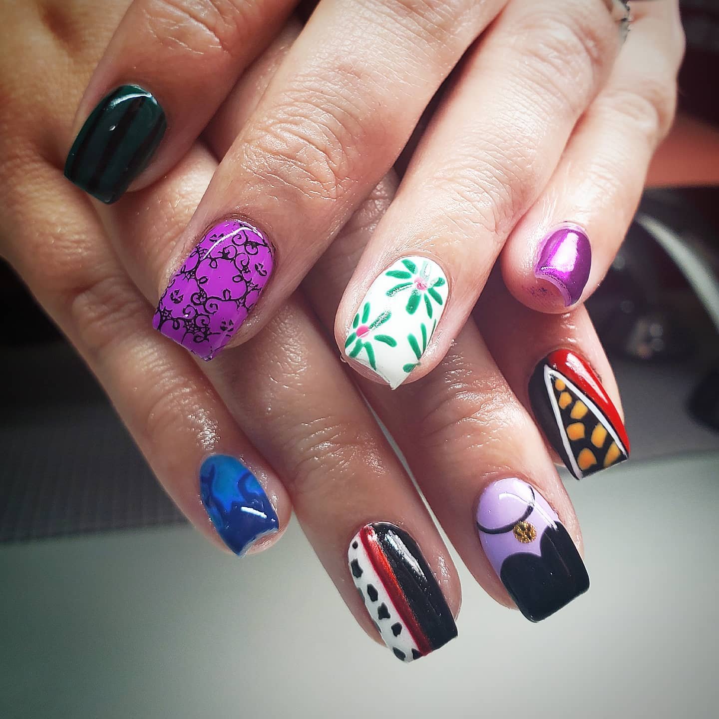 Mixed Purple, Black, Blue, and White Graphic Nail Art