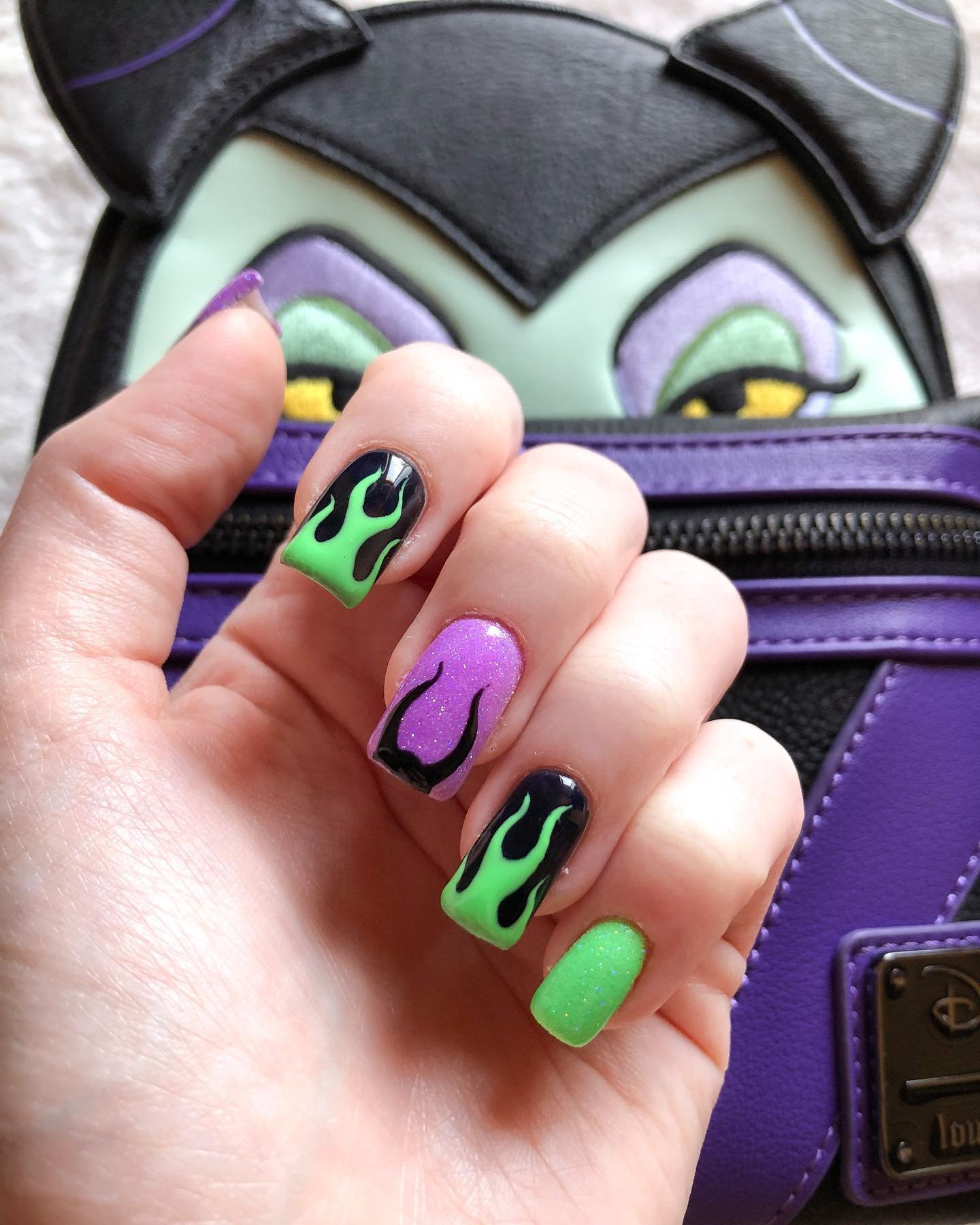 Black Nails with Neon Green and Purple Graphic Accents